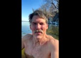 This screen shot from cell phone video provided by Eric Hovde’s campaign shows the candidate for U.S. Senate shirtless in the cold waters of Lake Me