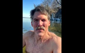 This screen shot from cell phone video provided by Eric Hovde’s campaign shows the candidate for U.S. Senate shirtless in the cold waters of Lake Me