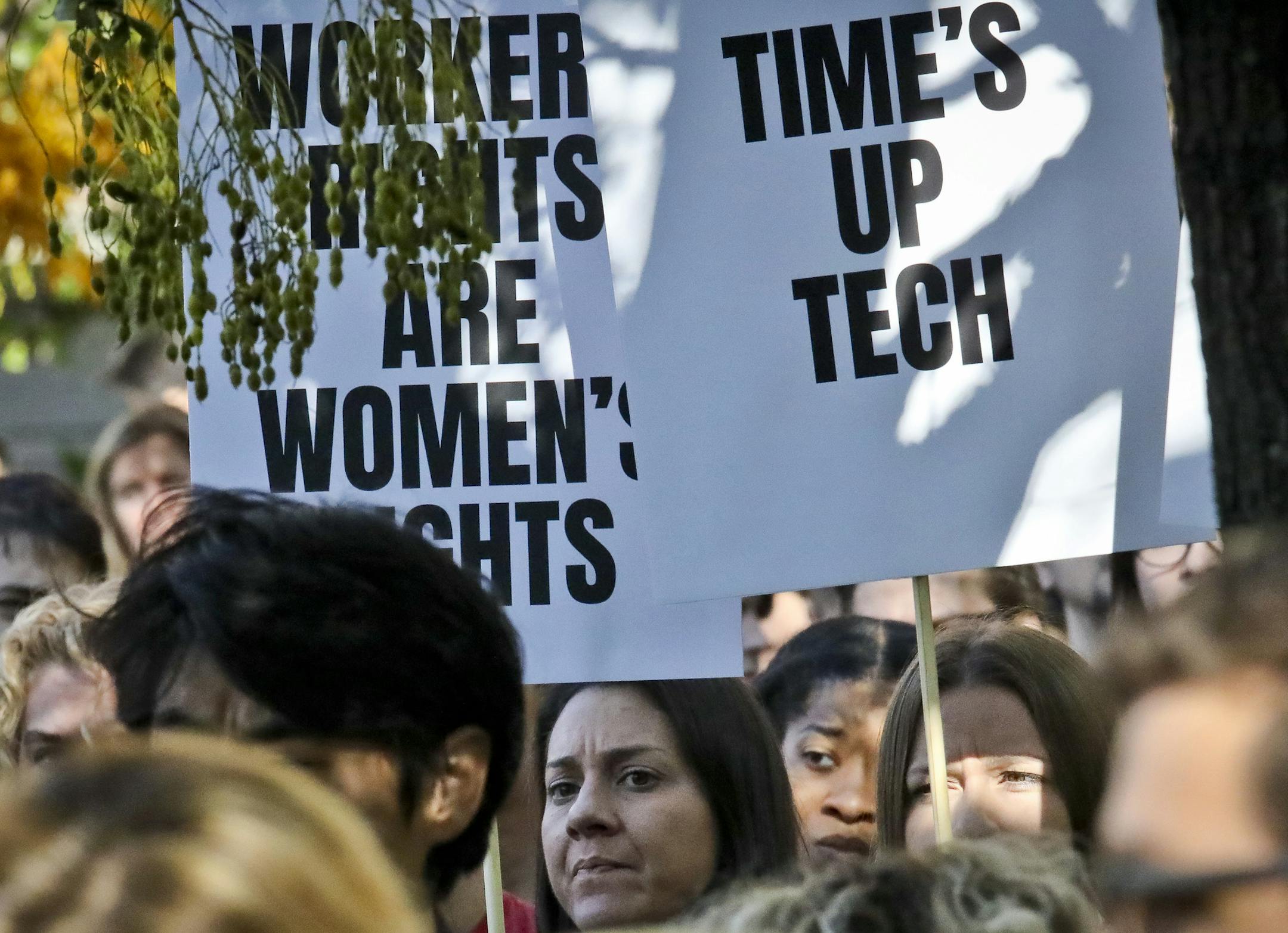 Google employees, who walked off the job to protest the internet company's lenient treatment of executives accused of sexual misconduct, listen to speakers during a protest rally on Thursday, Nov. 1, 2018, in New York. Employees staged walkouts at offices from Tokyo to Singapore to London. (AP Photo/Bebeto Matthews) ORG XMIT: NYBM103