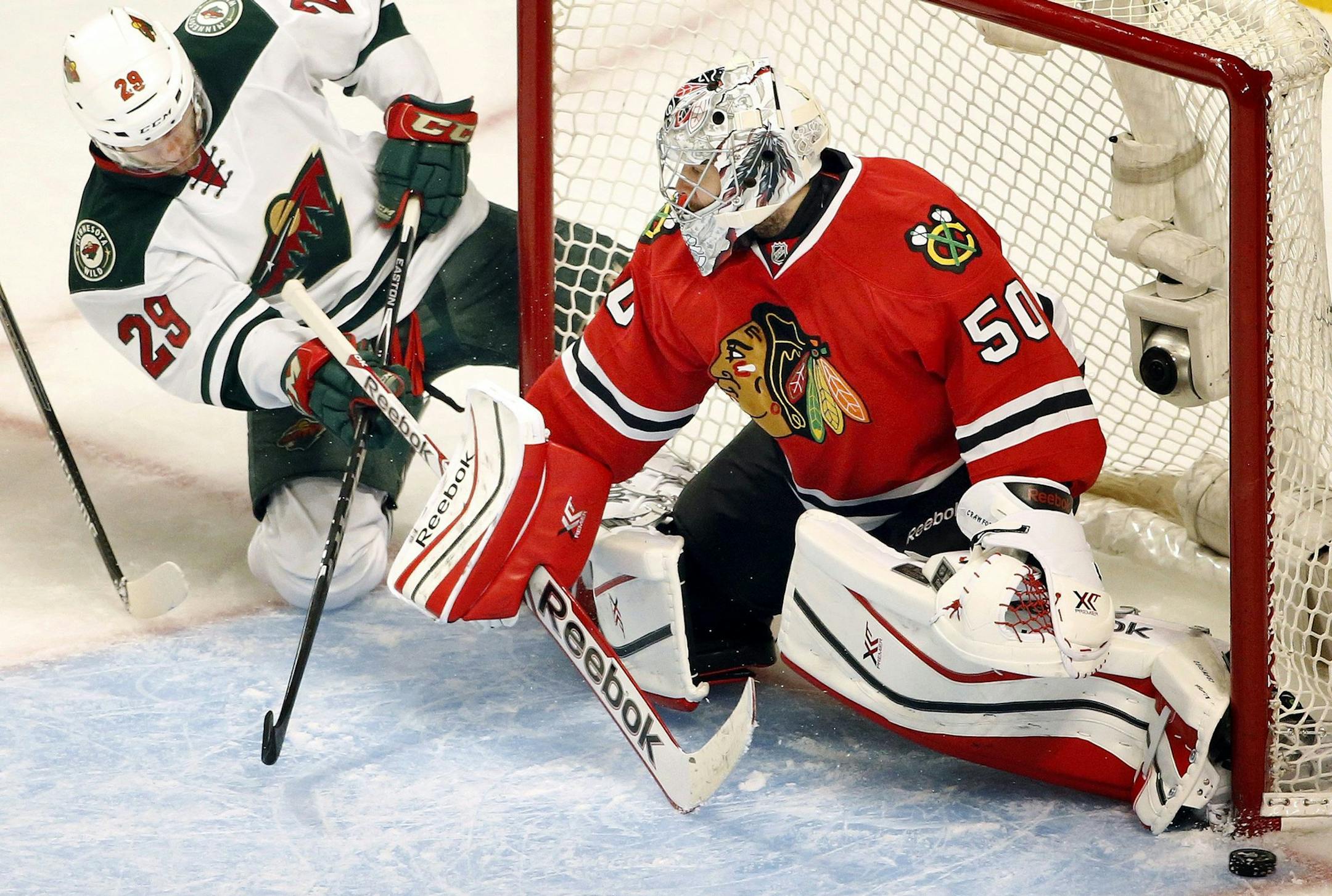 Minnesota Wild's Jason Pominville (29) attempts a shot on Chicago Blackhawks goalie Corey Crawford (50) in the third period at the United Center on Sunday, May 4, 2014, in Chicago. The Blackhawks defeated the Wild, 4-1, during Game 2 of a Western Conference semifinal. (Carlos Gonzalez/Minneapolis Star Tribune/MCT) ORG XMIT: 1152516 ORG XMIT: MIN1405041852055206