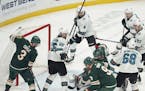 Failed whacks at the puck by (from left) Charlie Coyle, Mikko Koivu and Zach Parise summed up the Wild's frustration Tuesday.