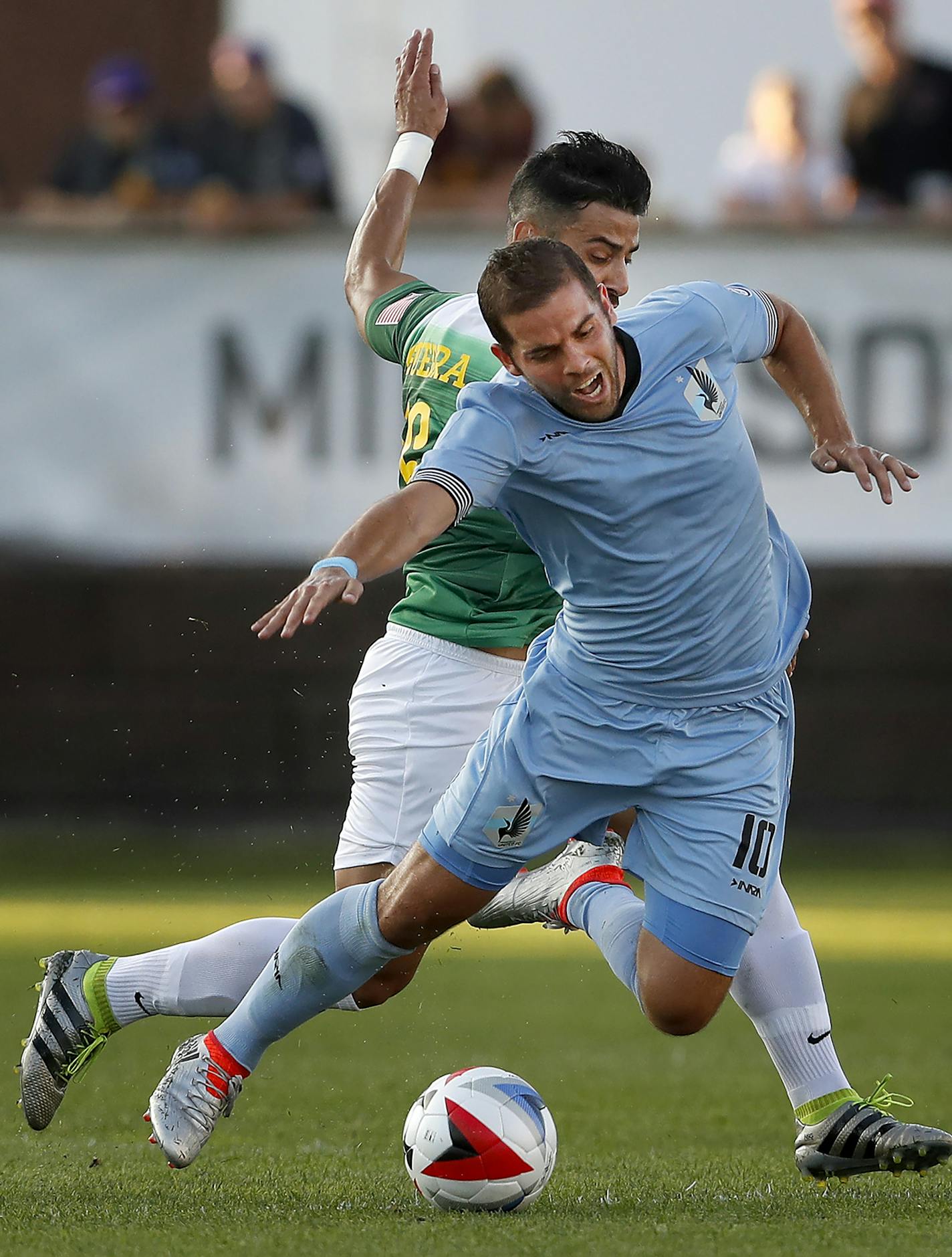 Juan Guerra (16) tripped up Ben Speas (10) in the first half. ] CARLOS GONZALEZ cgonzalez@startribune.com - August 17, 2016, Blaine, MN, National Sports Center, Soccer, Minnesota United vs. Tampa Bay Rowdies