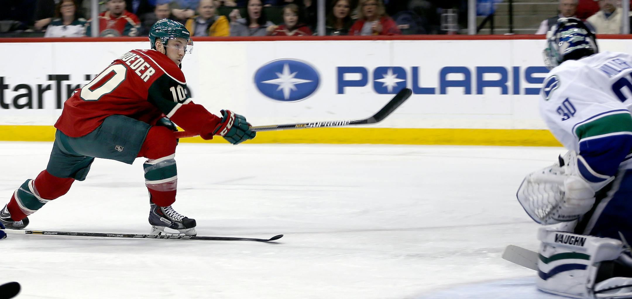 Jordan Schroeder (10) shot the puck past Vancouver Canucks goalie Ryan Miller (30) for a goal in the first period. ] CARLOS GONZALEZ cgonzalez@startribune.com, February 9, 2015, St. Paul, Minn., Xcel Energy Center, NHL, Minnesota Wild vs. Vancouver Canucks