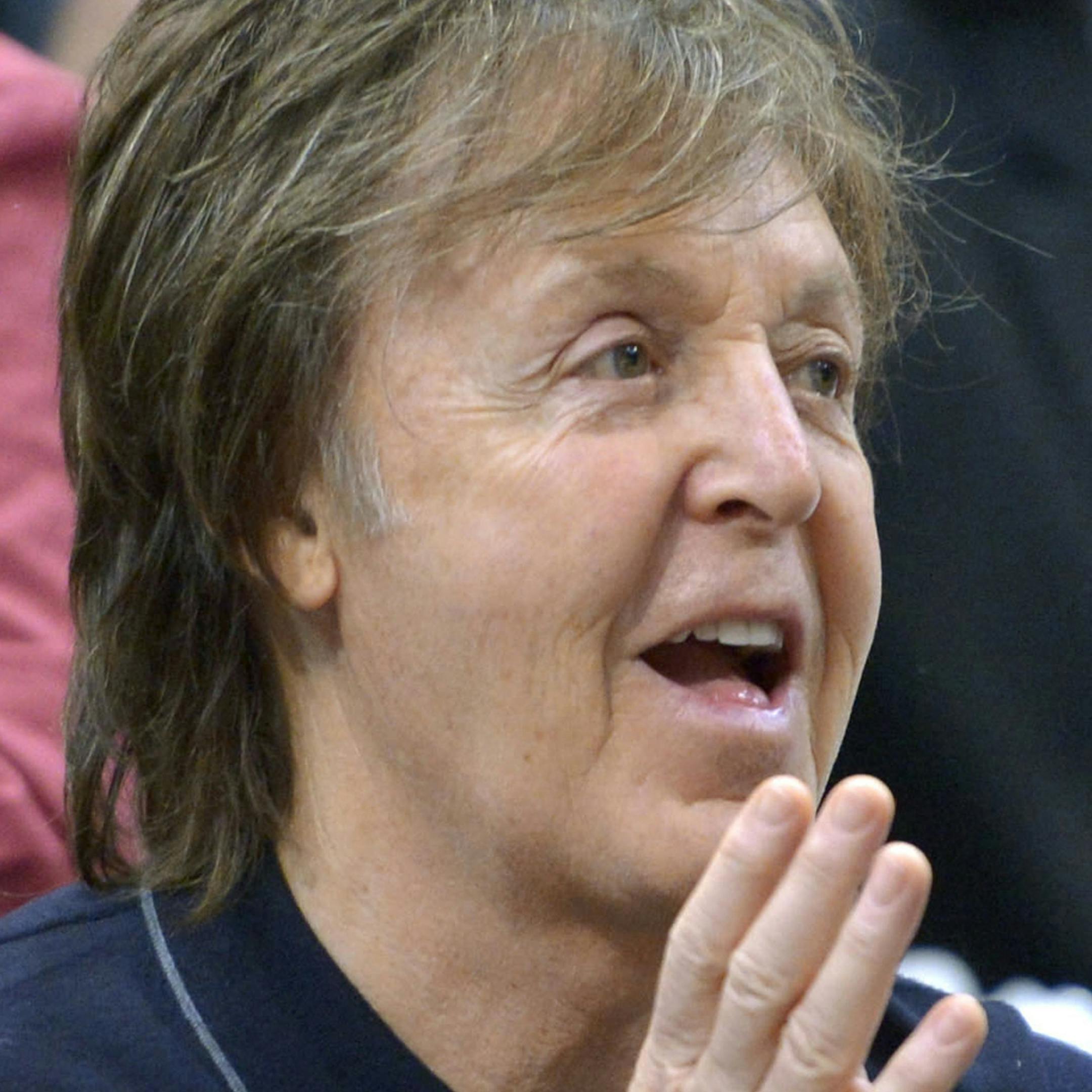 Paul McCartney watches a sumo match on the fifth day of the Kyushu Grand Sumo Tournament, in Fukuoka, western Japan, Thursday, Nov. 14, 2013. In an open letter posted on McCartney's official website Thursday, McCartney urges Russian President Vladimir Putin to help secure the release of Greenpeace activists who were detained during a protest at a Russian oil rig in the Arctic on Sept. 18, 2013 and are being held in Russia. (AP Photo/Kyodo News) JAPAN OUT, MANDATORY CREDIT