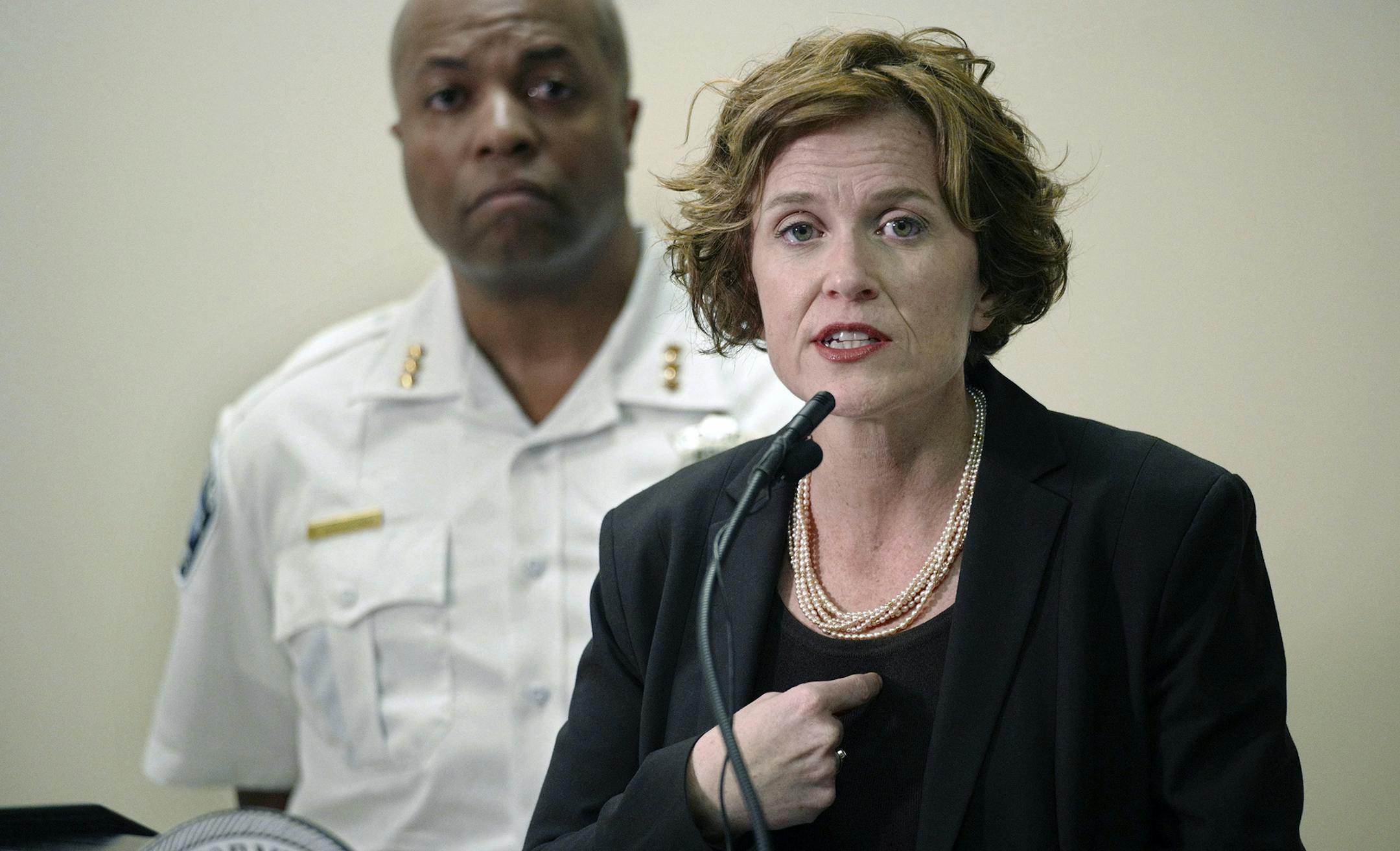 Mayor Betsy Hodges and Assistant Police Chief Medaria Arradondo address the latest developments in the death of Justine Damond, Tuesday, July 18, 2017, in Minneapolis, Minn. Damond, of Australia, was shot and killed on Saturday, July 15 by a Minneapolis police officer after she called 911 to report what she believed to be a possible assault. (Richard Tsong-Taatarii/Star Tribune via AP) ORG XMIT: MIN2017071914322623
