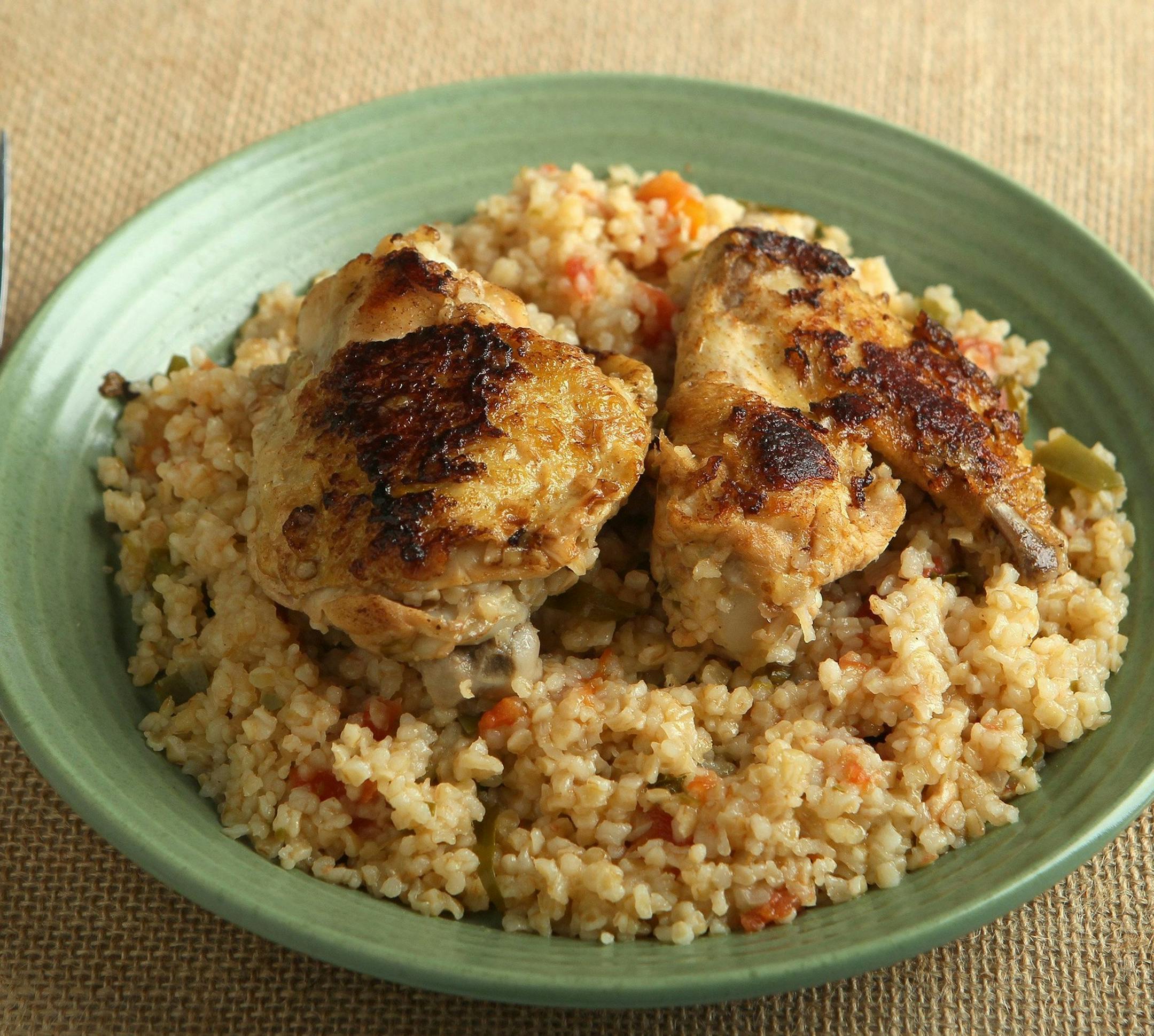 Tarragon can be used as a bright punctuation to chicken, such as in this chicken with Bulgur, tomatoes, peppers and tarragon. (Roberto Rodriguez/St. Louis Post-Dispatch/MCT) ORG XMIT: 1156938