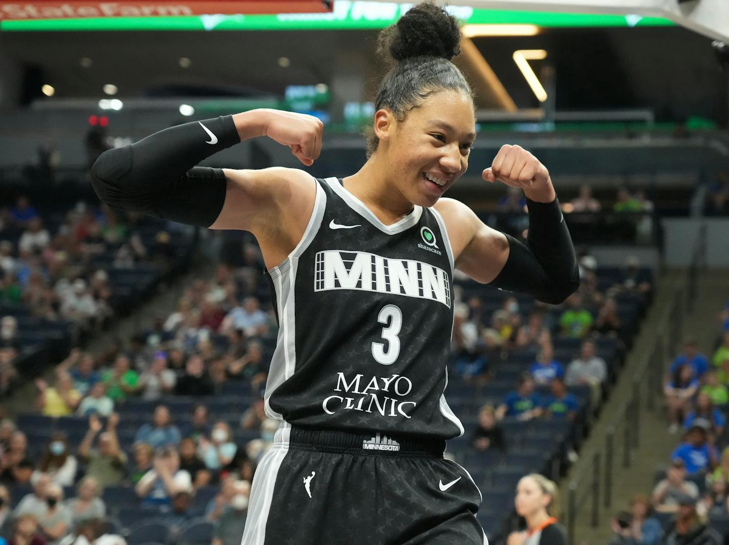 Minnesota Lynx forward Aerial Powers (3) interacts with fans after a play during the second half of a WNBA basketball game against the Chicago Sky in Minneapolis, Wednesday, July 6, 2021. The Lynx won 81-78. (Shari L. Gross/Star Tribune via AP)