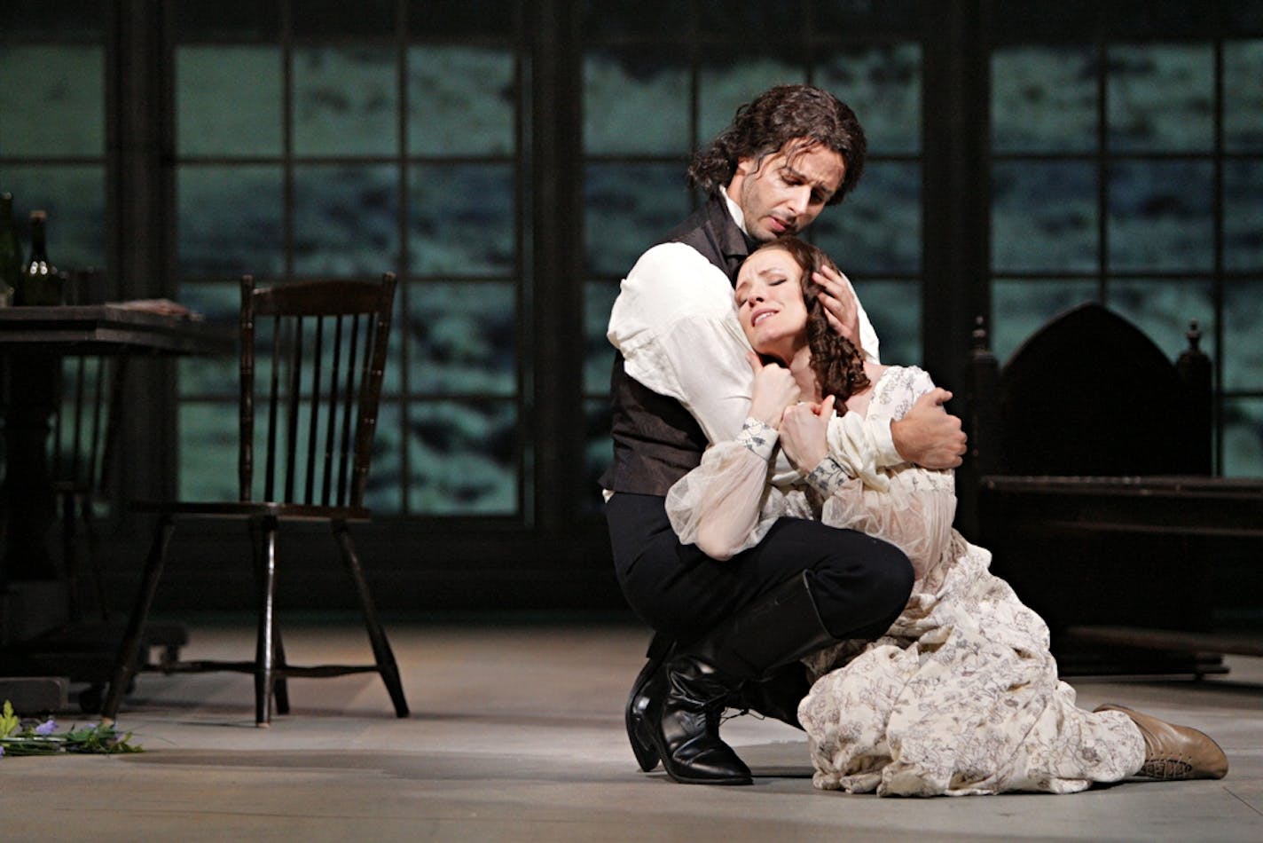 Lee Poulis as Heathcliff and Sara Jakubiak as Catherine Earnshaw in The Minnesota Opera production of Wuthering Heights Music by Bernard Herrmann Libretto by Lucille Fletcher Creative Team: Conductor - Michael Christie Stage Director - Eric Simonson Set Designer - Neil Patel Costume Designer - Jane Greenwood Lighting Designer - Robert Wierzel Projection Designer - Wendall K. HarringtonÊÊÊÊÊÊÊ The Cast: Catherine Earnshaw - Sara Jakubiak Heathcliff - Lee Poulis Hindley Earnshaw, Catherine's broth