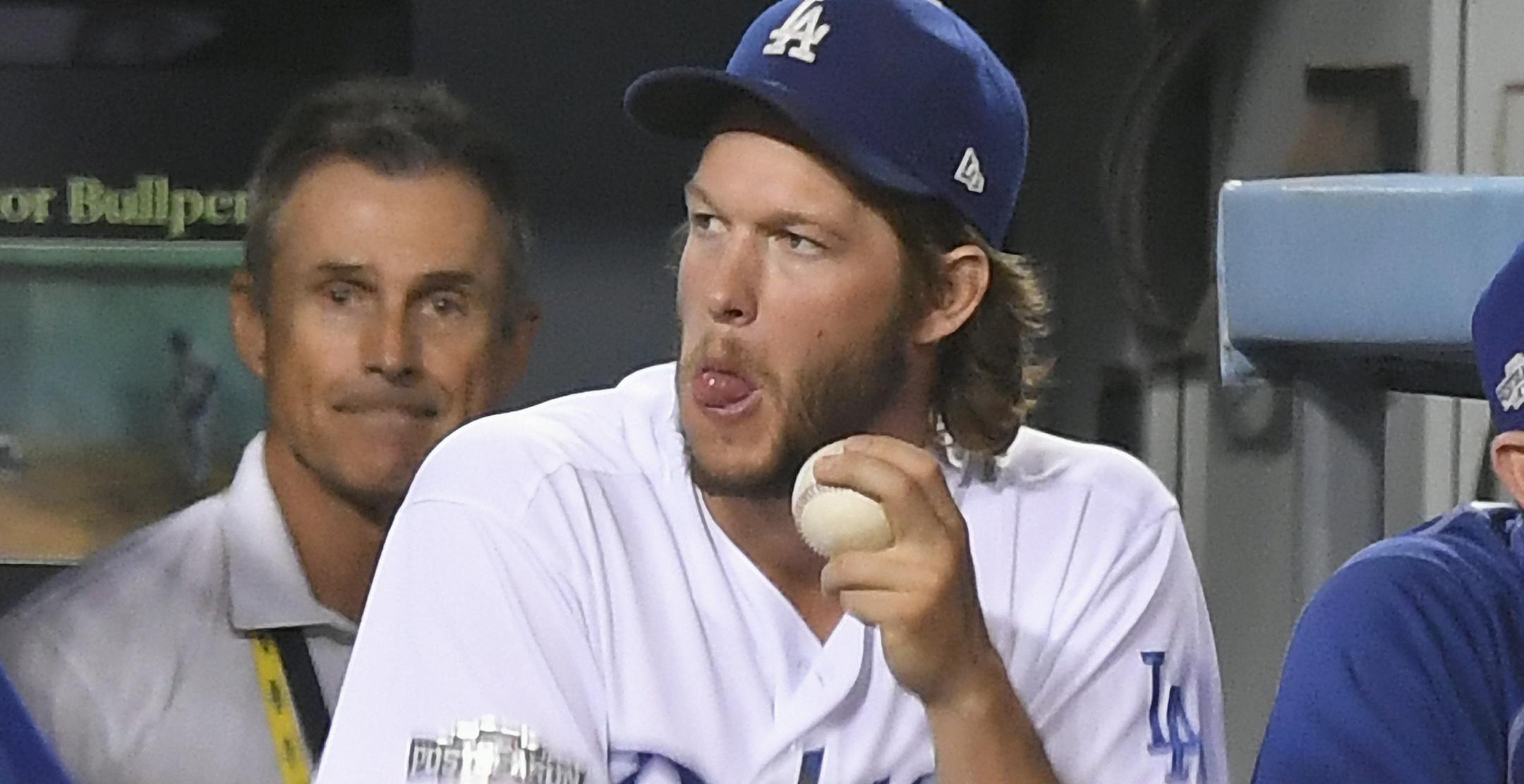 Los Angeles Dodgers' Clayton Kershaw watches from the dugout during the sixth inning of Game 5 of the National League baseball championship series against the Chicago Cubs Thursday, Oct. 20, 2016, in Los Angeles. (AP Photo/Mark J. Terrill)
