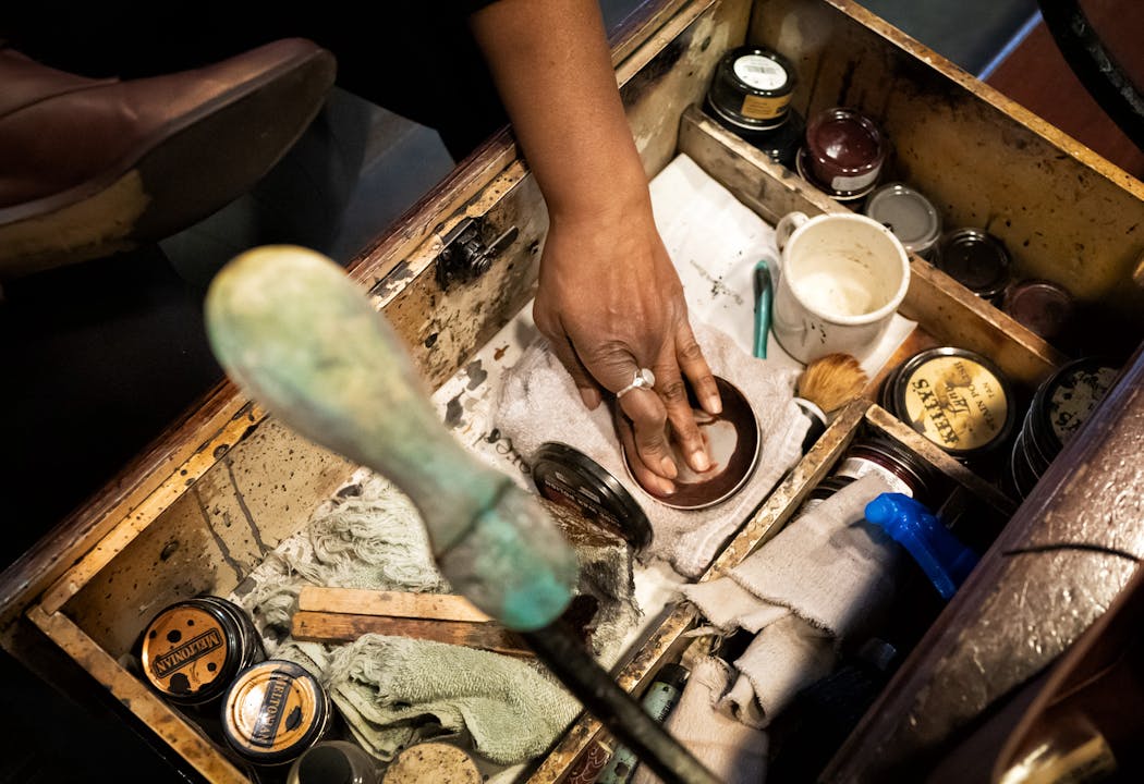 Lisa Cotton worked on one of her final days in her shoeshine stand in the IDS Center. One of her pro tips for those Minnesota salt-crusted shoes in wintertime: Wipe them down with a cotton rag doused some white vinegar.