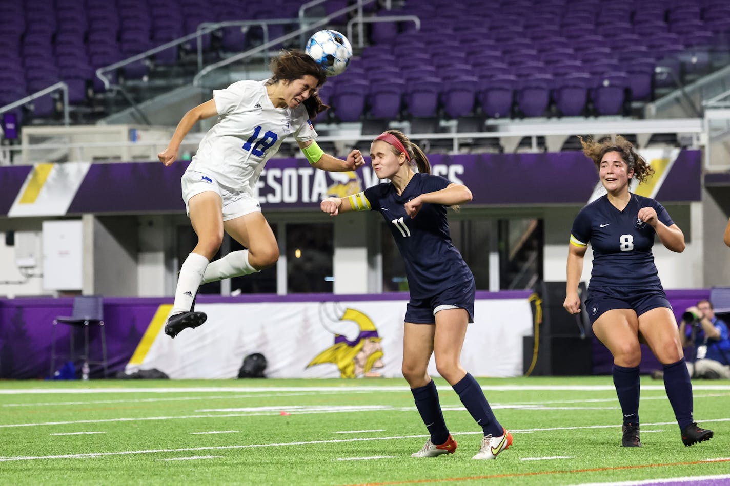 St. Anthony's Eileen Cardona leaped high for a header Friday, getting the ball over the head of Heidi Deuel (11).