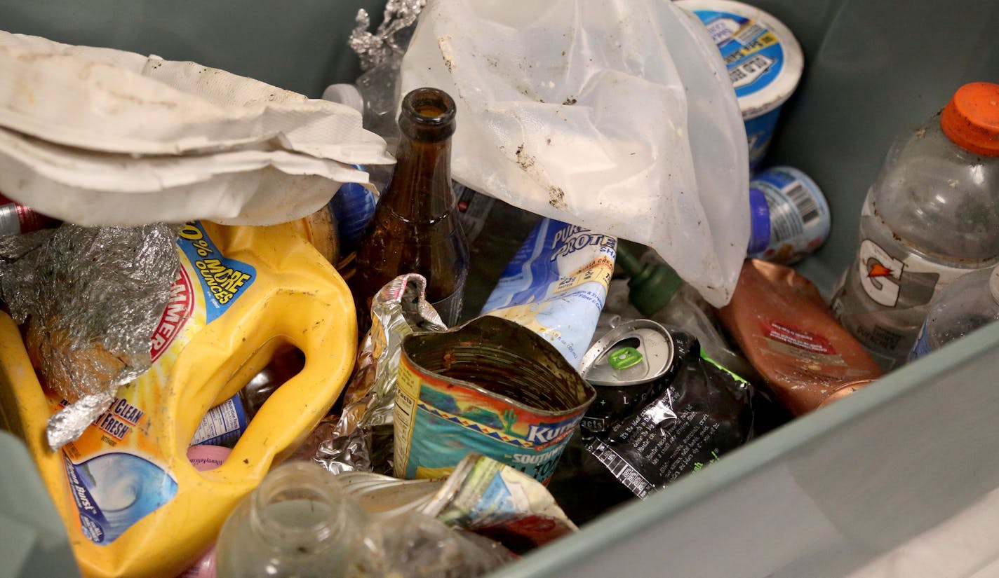 Recyclables found in trash bags brought in by trash haulers as part of a week-long study of trash at the Hennepin Energy Recovery Center (HERC) May, 12, 2016, in Minneapolis, MN.](DAVID JOLES/STARTRIBUNE)djoles@startribune Hennepin County is digging into residents garbage to learn more about what they are throwing away and what opportunities we are missing to recycle more. The study involves sorting trash into new categories that will provide better, more specific information about what could be