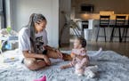 Napheesa Collier played with her 11-month-old daughter, Mila, at their Minneapolis apartment.