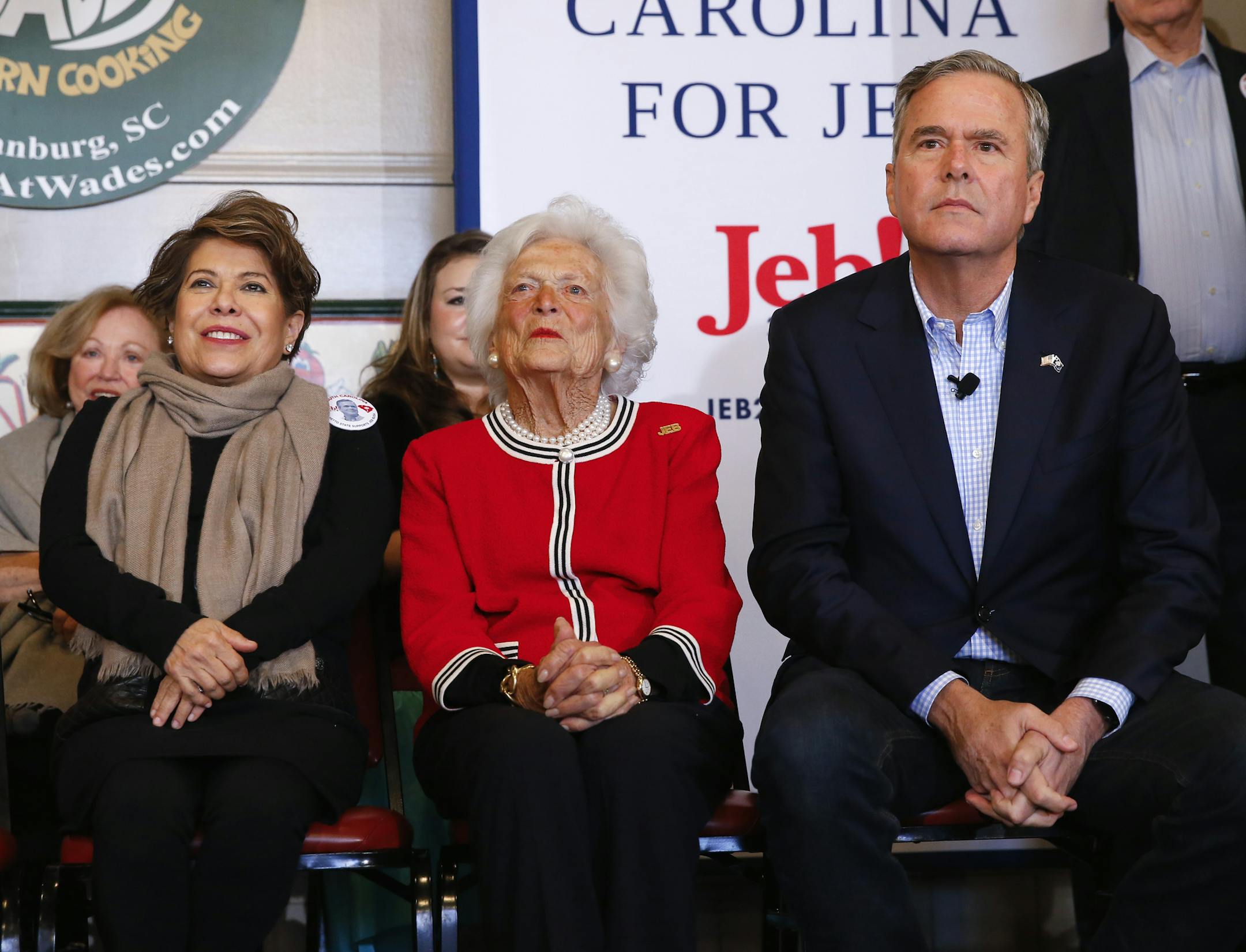 Republican presidential candidate, former Florida Gov. Jeb Bush, sits with his mother, former first lady Barbara, and wife Columba, during a campaign stop at Wade's Restaurant, Friday, Feb. 19, 2016 in Spartanburg, S.C. (AP Photo/Paul Sancya)