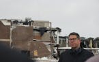 Duluth Public Schools Superintendent John Magas spoke to members of the media Friday as demolition work of the former Central High School went on behi