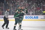 Wild left wing Matt Boldy, left, helped defenseman Brock Faber celebrate his first NHL goal in the first period Thursday.