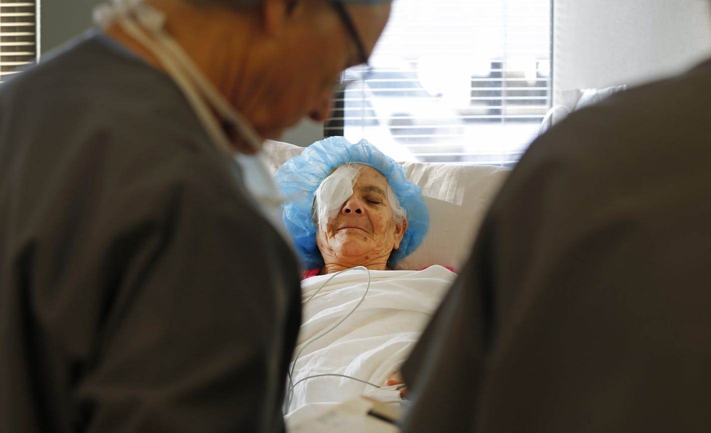 Maria Flores DeCalles rested in the post-operation room after having a cataract removed from her right eye.