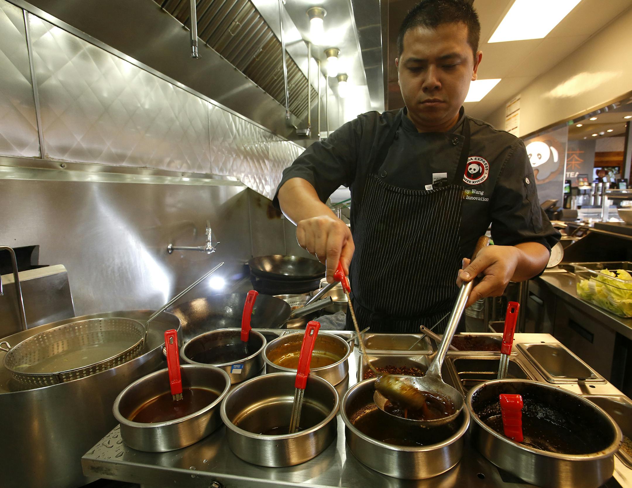 Jimmy Wang, Panda Express' director of culinary innovation, tries to find the winning recipe for lion's head meatballs. "There's a way to make this dish. I just haven't found it yet," Wang, 36, said of the meatballs. (Don Bartletti/Los Angeles Times/TNS) ORG XMIT: 1170455