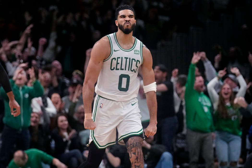 Celtics forward Jayson Tatum, who scored 45 points, was fired up after he sank a three-pointer during overtime in a win over the Wolves on Wednesday night.