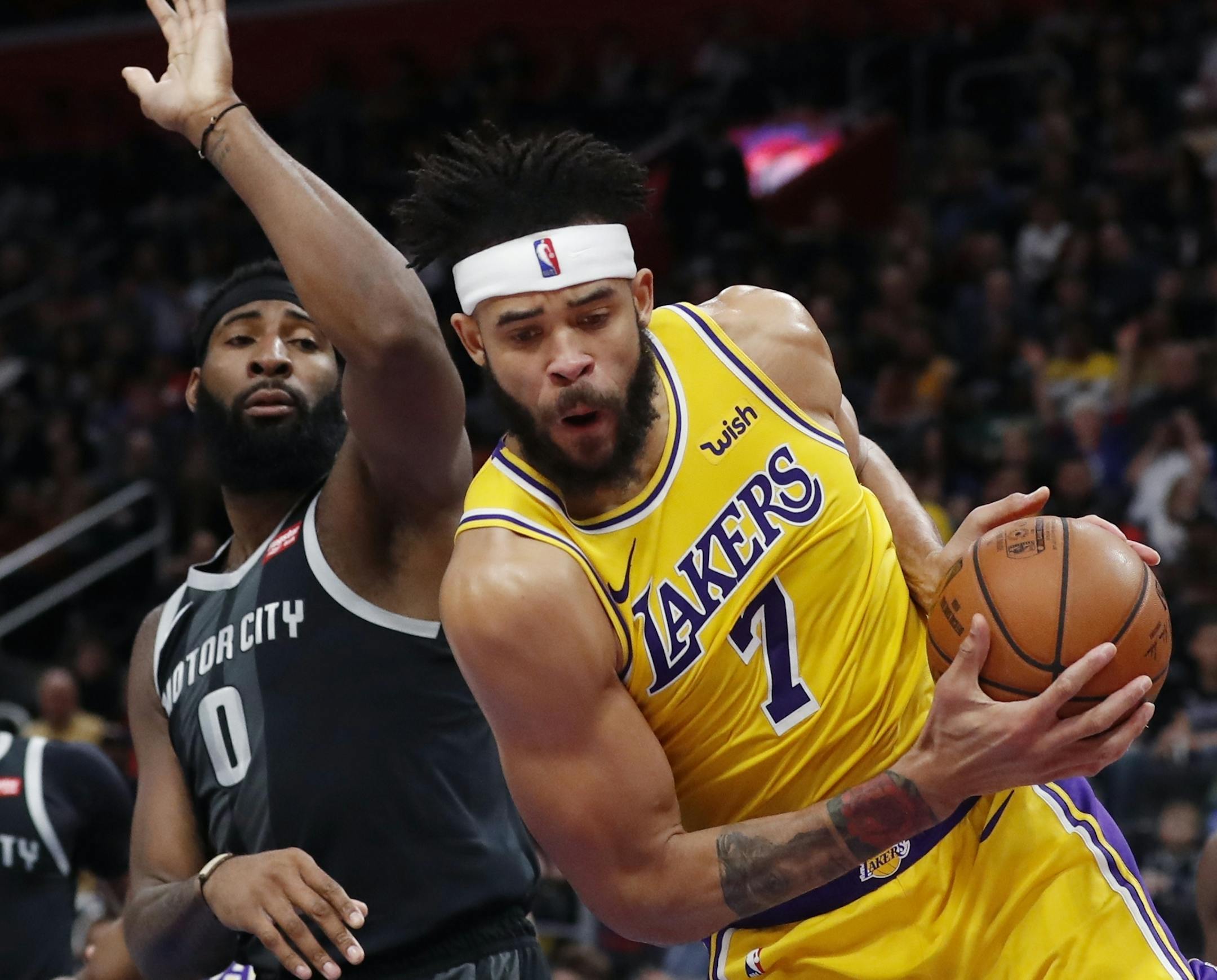 Los Angeles Lakers center JaVale McGee (7) grabs a rebound as Detroit Pistons center Andre Drummond (0) defends during the first half of an NBA basketball game, Friday, March 15, 2019, in Detroit. (AP Photo/Carlos Osorio)