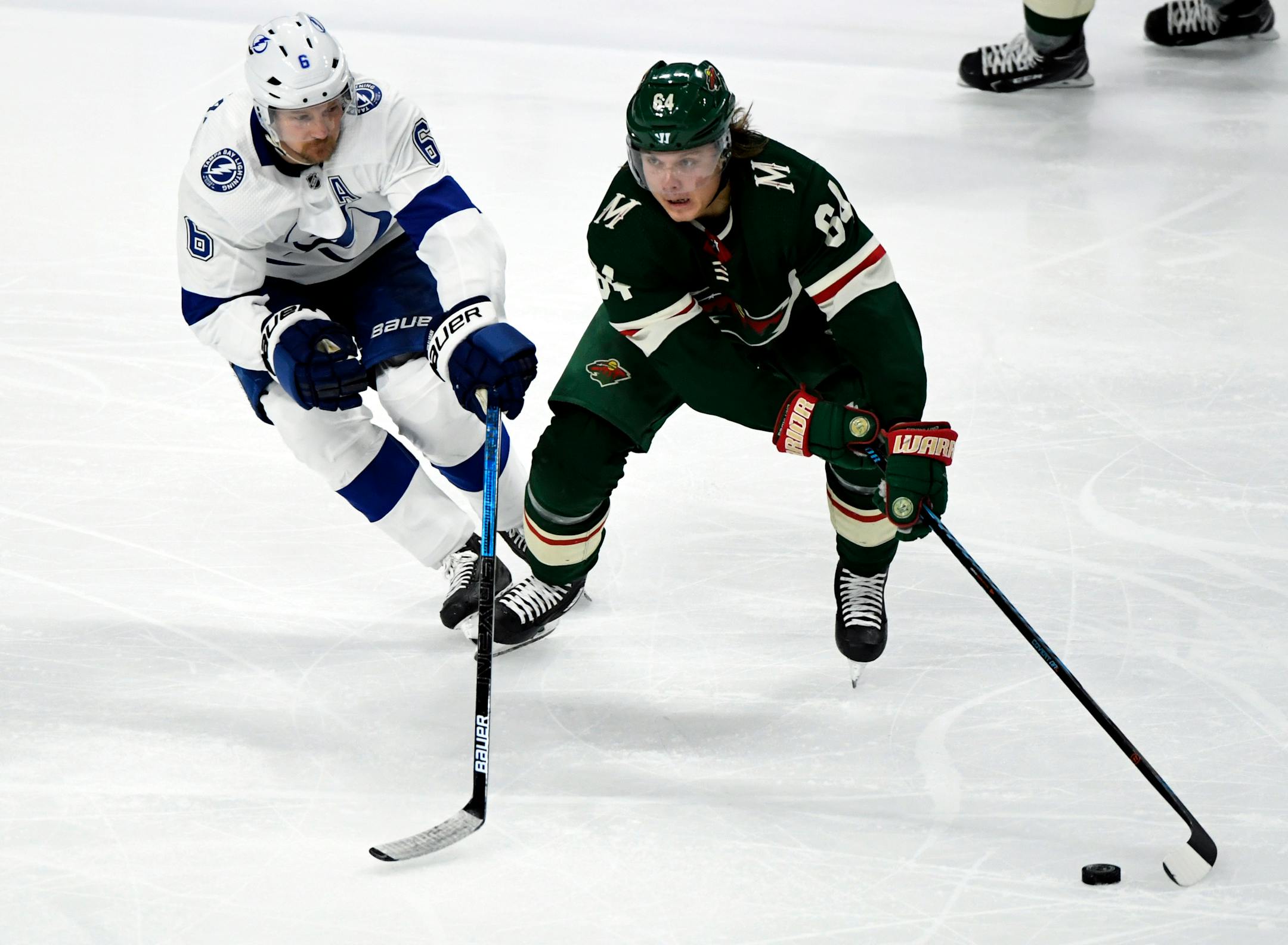 The Wild's Mikael Granlund skates with the puck against the Lightning's Anton Stralman in the third period