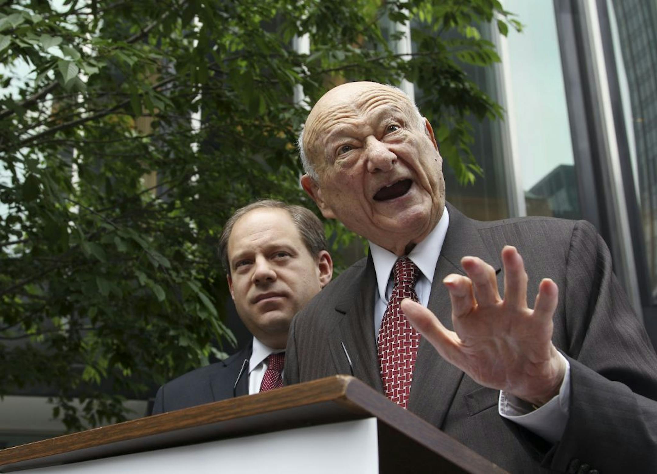 FILE - In this May 16, 2012, file photo, former New York Mayor Ed Koch, right, talks to reporters as Assemblyman Rory Lancman watches in New York. Koch, the combative politician who rescued the city from near-financial ruin during three City Hall terms, has died at age 88. Spokesman George Arzt says Koch died Friday morning Feb. 1, 2013 of congestive heart failure. (AP Photo/Frank Franklin II, File)