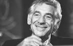 FILE - In this July 26, 1971 file photo conductor Leonard Bernstein tells reporters in Washington that the work he is preparing for the 1971 opening o