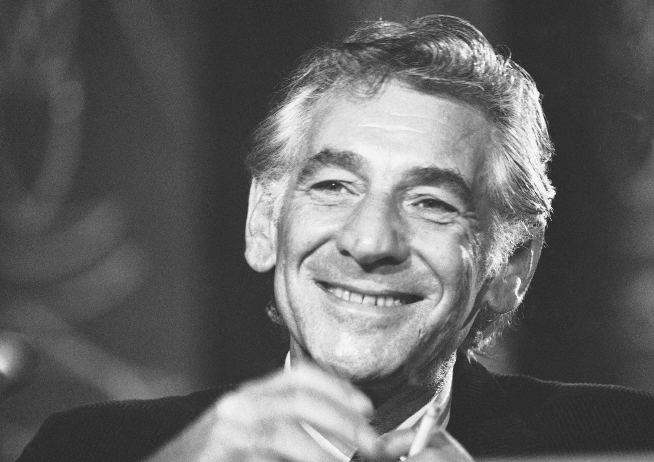 FILE - In this July 26, 1971 file photo conductor Leonard Bernstein tells reporters in Washington that the work he is preparing for the 1971 opening of the John F. Kennedy Center for the Performing Arts is a "labor of love." Leonard Bernstein is getting a musical tribute thatís off the charts on the 100th anniversary of the maestroís birth. The Boston Symphony Orchestra will be joined by musicians from the New York Philharmonic, Vienna Philharmonic Orchestra, Israel Philharmonic Orches