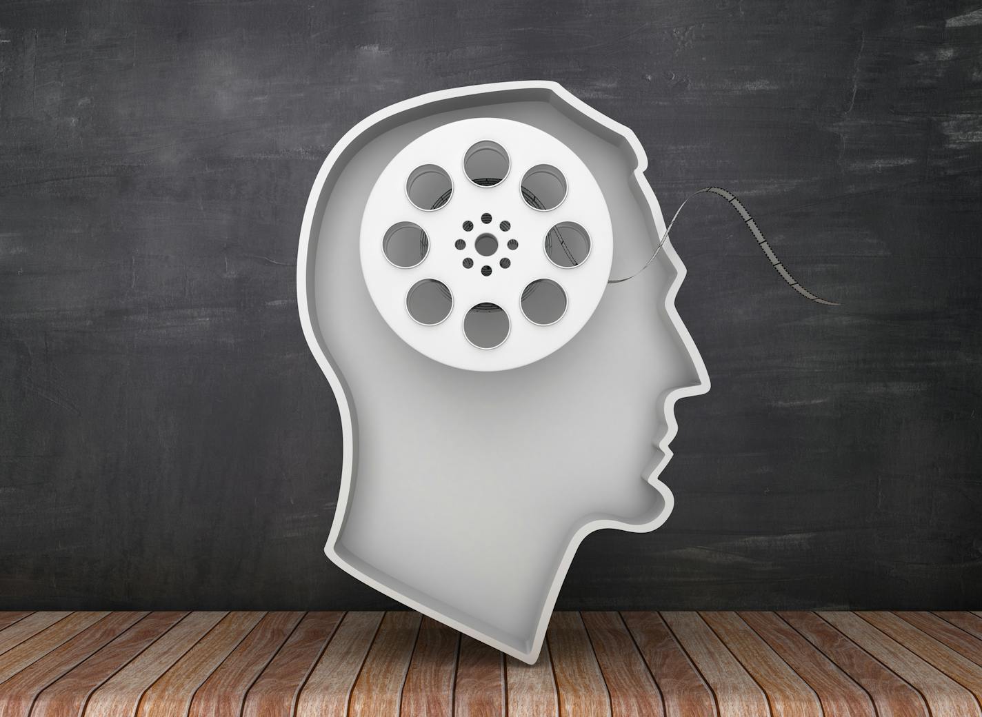 Human Head Shape with Film Reel on Chalkboard Background - 3D Rendering