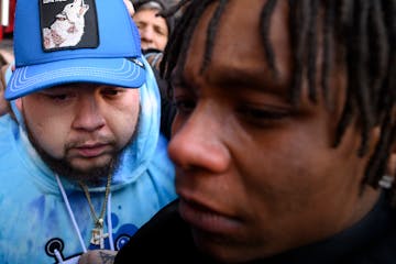 Damik Bryant, Daunte Wright’s brother, and Emajay Driver, Wright’s close friend, react after the guilty verdict was read Thursday, Dec. 23, 2021 o