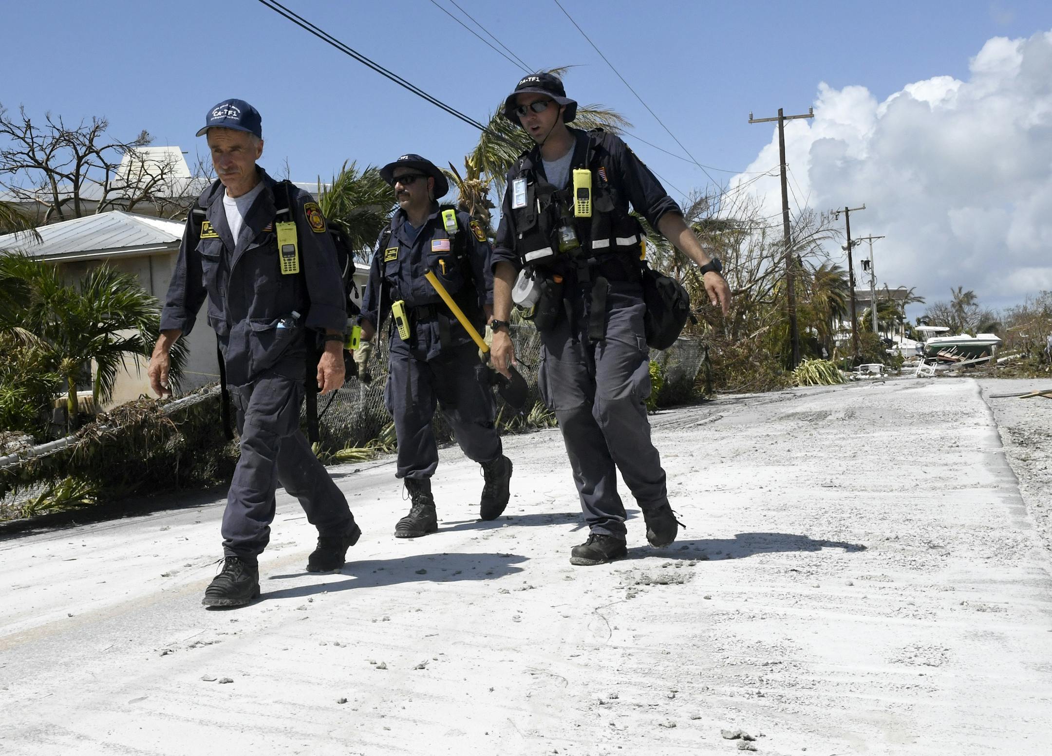 Los Angeles City Fire Department FEMA California Task Force 1 goes house-to-house looking for residents in Cudjoe Key, Fla., where Hurricane Irma's eye made landfall, on Tuesday, Sept. 12, 2017. (Taimy Alvarez/Sun Sentinel/TNS) ORG XMIT: 1210901