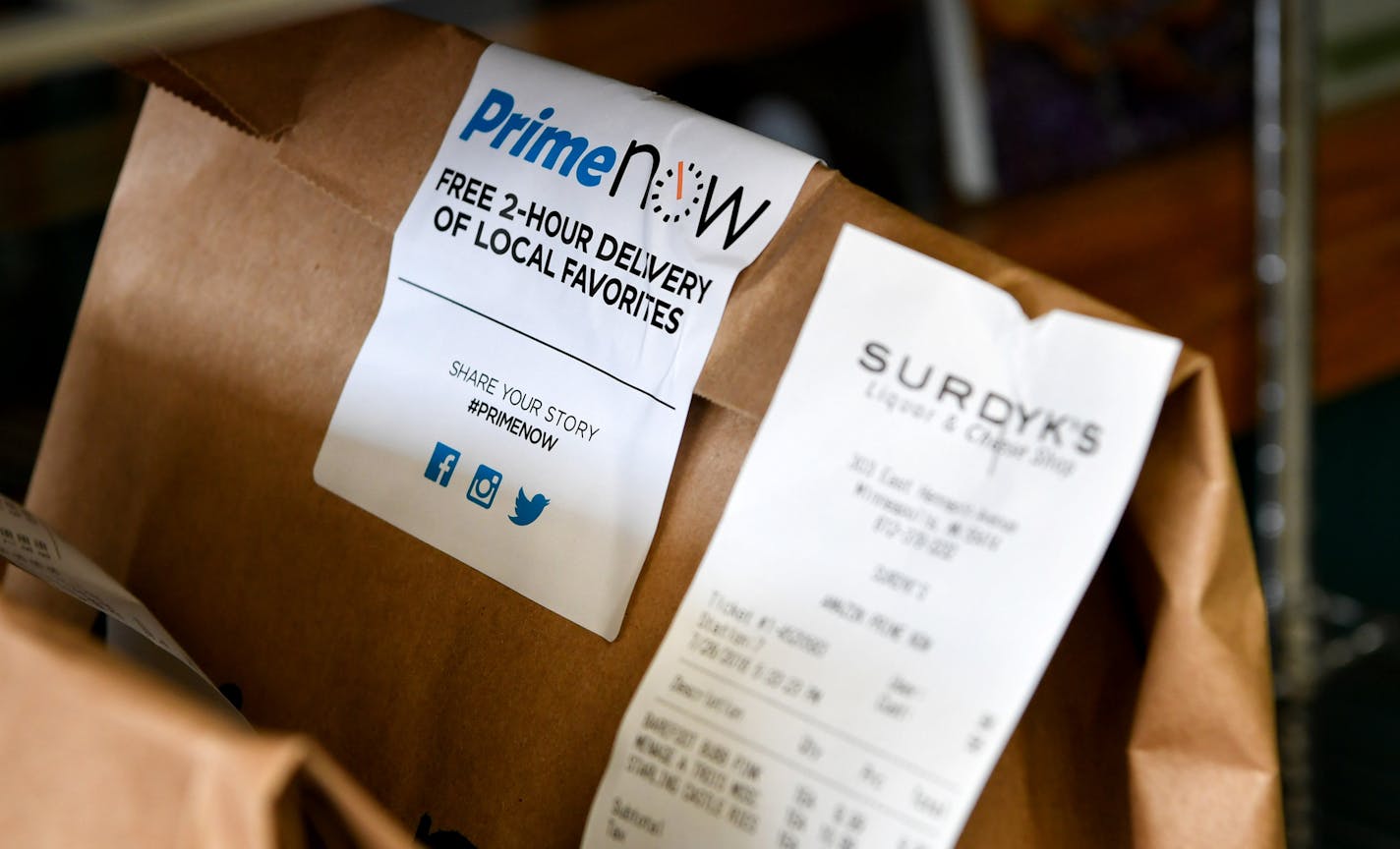 Brian Krause, delivery manager for Surdyk's said they have prepared over 200 deliveries on their first full day of offering two hour service through Amazon Prime. ] GLEN STUBBE * gstubbe@startribune.com Thursday, July 28, 2016 Amazon does its first alcohol deliveries in the Twin Cities. Workers at Surdyk's Liquor & Cheese Shop are now fulfilling delivery orders for Amazon.com's Prime Now service. They pick bottles and cans from shelves and put them in special bags. EDS. Brian Krause is pictured