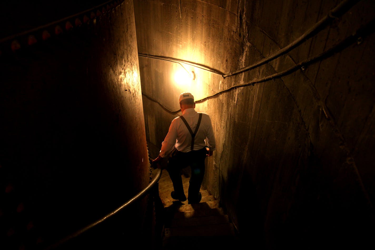 ELIZABETH FLORES ¥ eflores@startribune.com May 18, 2010 - Minneapolis, MN - The annual neighborhood ice cream social on June 4 which features tours of The Witch's Tower. Tony Garmers, 87, who lives in the Prospect neighborhood, who actually supervises the tower tours. IN THIS PHOTO:] Tony Garmers made his way down The Witch's Tower as he helped prepare for the upcoming ice cream social.