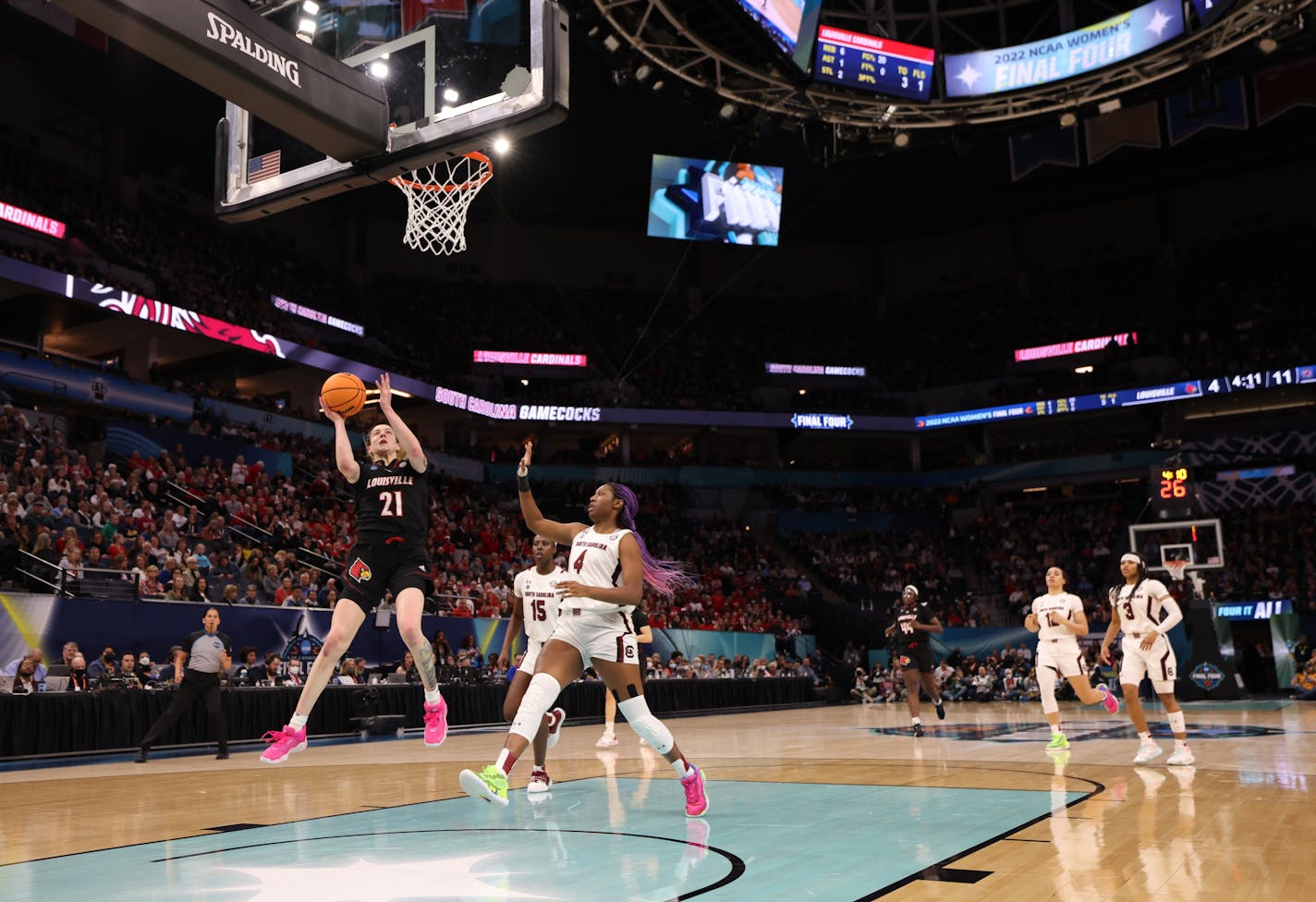 Louisville forward Emily Engstler drives to the basket past South Carolina's Aliyah Boston on Friday night. Both players made impacts on the game.