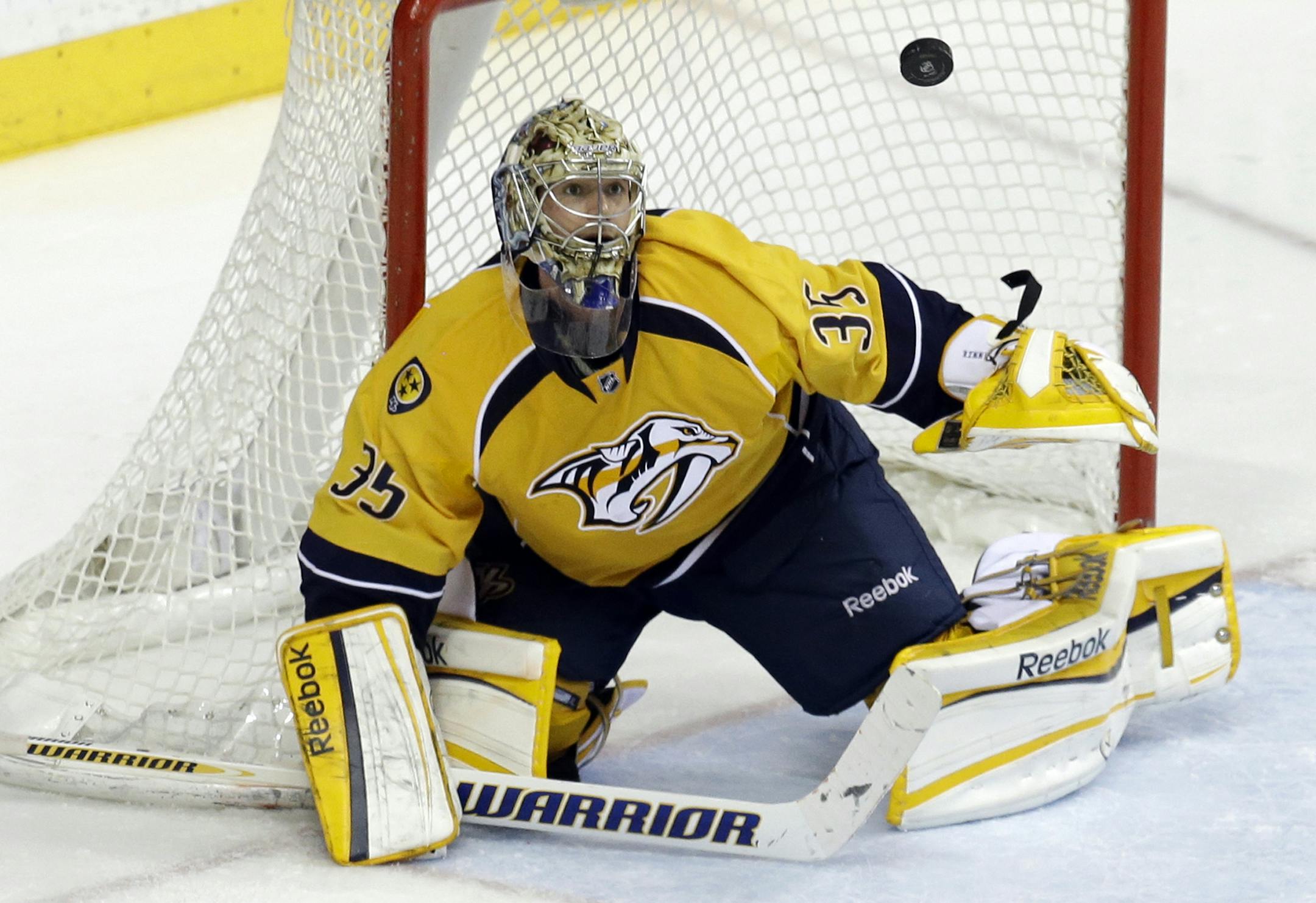 Nashville Predators goalie Pekka Rinne, of Finland, blocks a shot against the Columbus Blue Jackets in the third period of an NHL hockey game on Thursday, April 4, 2013, in Nashville, Tenn. The Blue Jackets won 3-1. (AP Photo/Mark Humphrey) ORG XMIT: TNMH131