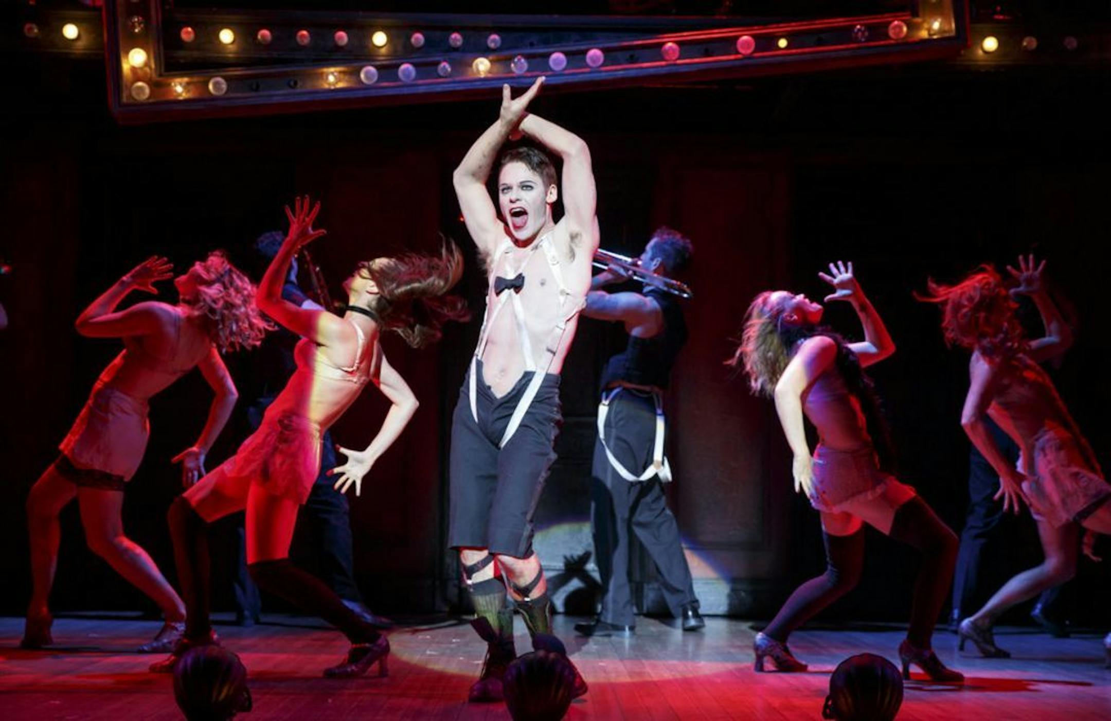 Randy Harrison as the Emcee and the 2016 National Touring cast of Roundabout Theatre Company�s CABARET. Photo by Joan Marucs