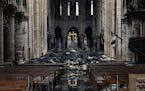 Fire damaged wood and stone sits near the altar inside Notre Dame Cathedral in Paris on April 16, 2019. MUST CREDIT: Bloomberg photo by Christophe Mor