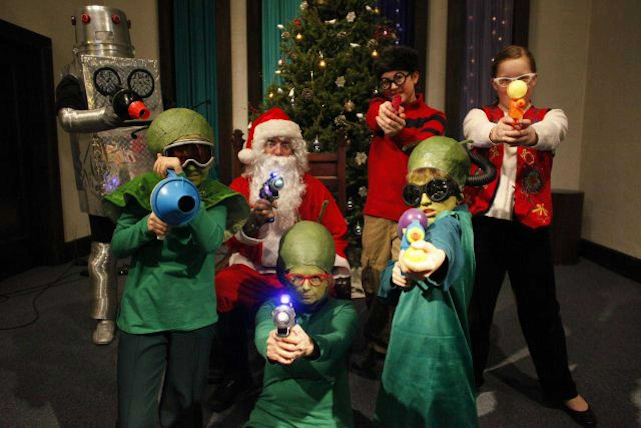 Members of the play �Santa Claus Conquers the Martians� left to right (back row) Jessica Harris, Kevin Johnson, Evan Green, and Carley Nelson. Front row left to right Ava Barry, Margot Barry, and Ben Johnson.