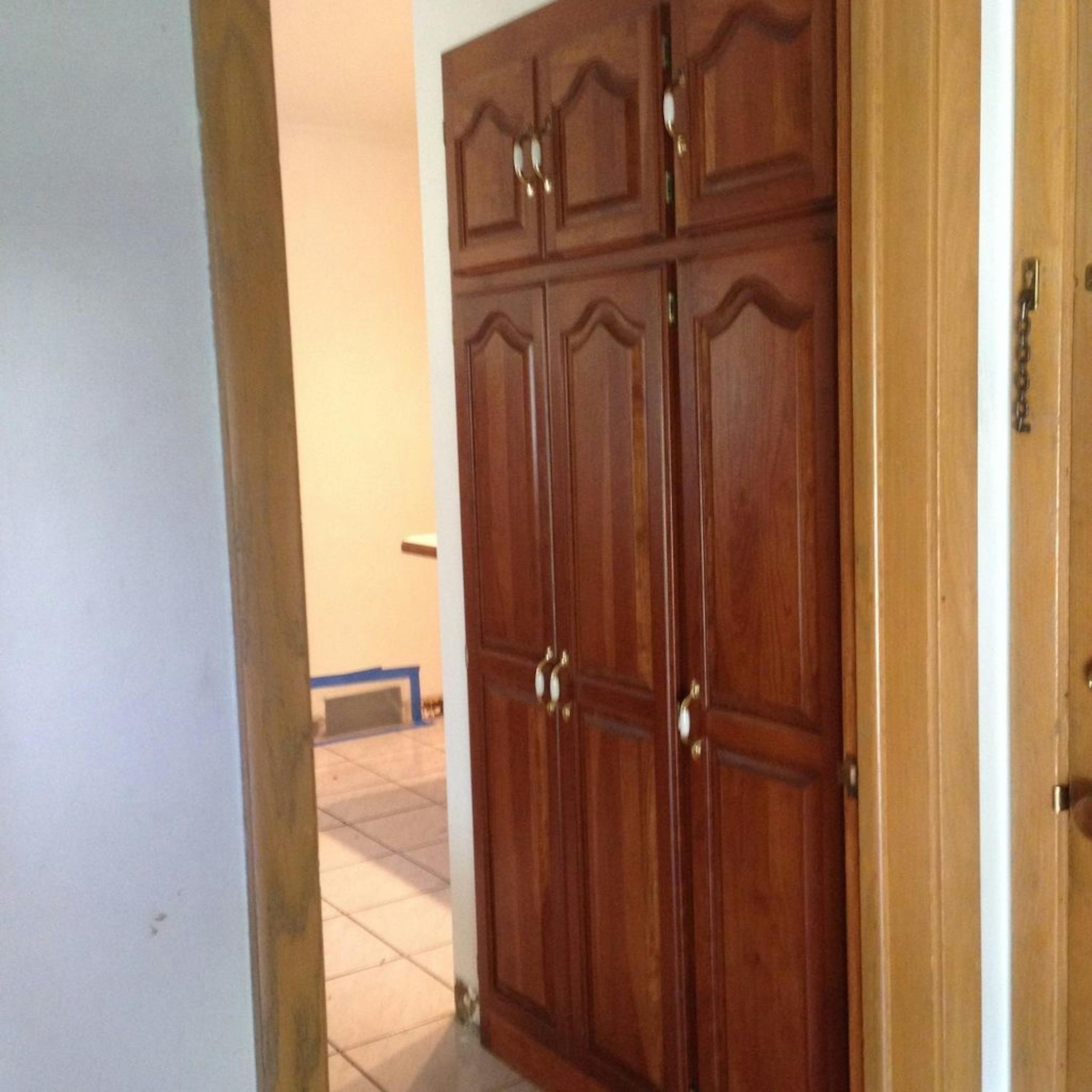 BEFORE A pantry cabinet was removed to create space for the mudroom.