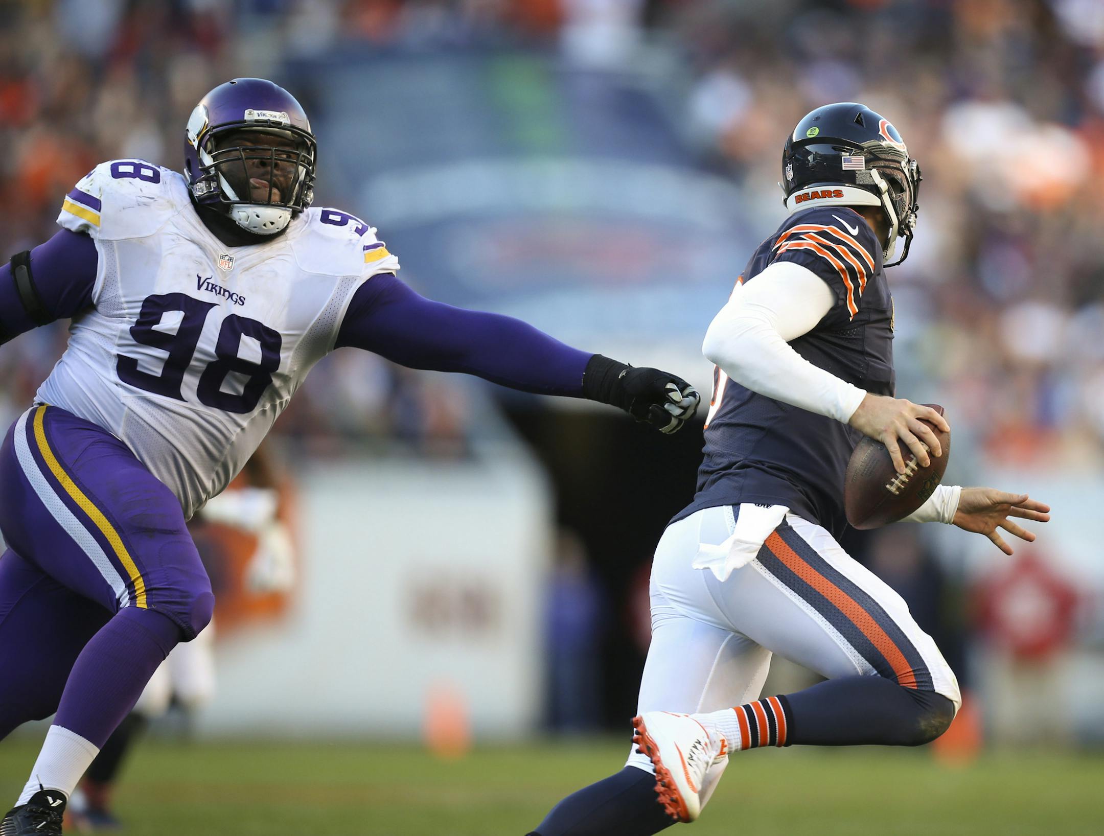 Bears quarterback Jay Cutler (6) slipped out of the grasp of Vikings defensive tackle Linval Joseph (98) before he threw an incomplete pass to Bears wide receiver Marquess Wilson (10) during the Bears' final possession in the fourth quarter Sunday afternoon. ] JEFF WHEELER &#xef; jeff.wheeler@startribune.com The Minnesota Vikings beat the Chicago Bears 23-20 on a last second field goal Sunday afternoon, November 1, 2015 at Soldier Field in Chicago.