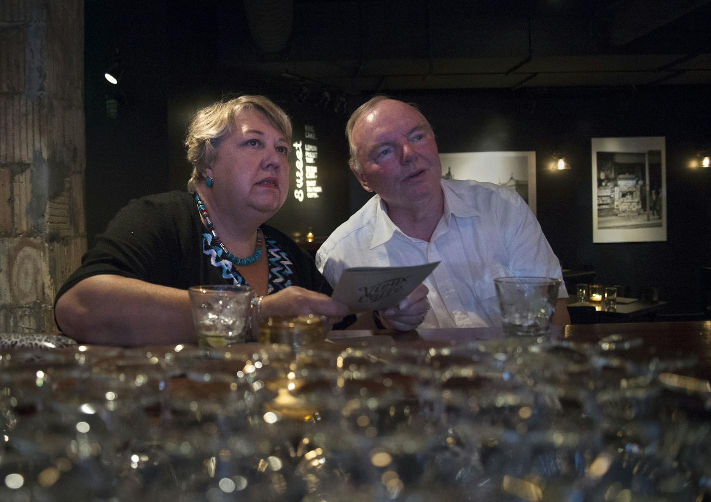 Jan and John Potthoff looked around at the new space while discussing the menu.