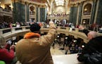 A crowd rallies inside the Wisconsin State Capitol as the state Assembly debates the right-to-work bill in Madison, Wis., Thursday, March 5, 2015.
