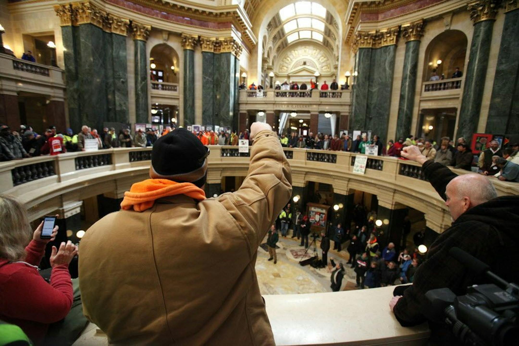 A crowd rallies inside the Wisconsin State Capitol as the state Assembly debates the right-to-work bill in Madison, Wis., Thursday, March 5, 2015.