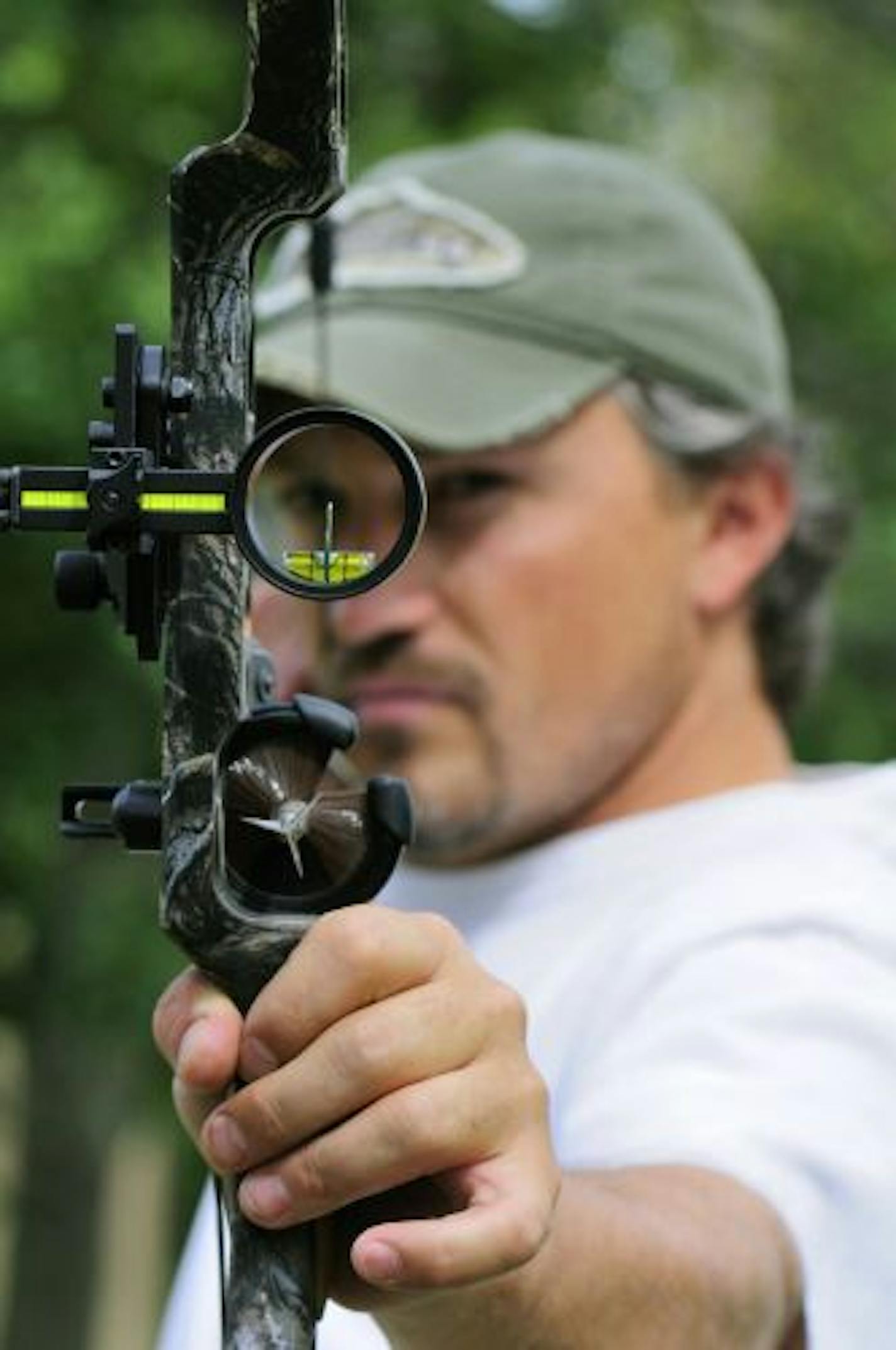 BILL MARCHEL ... 8/09 ... Brent Beimert of Beimert Outdoors in Pillager, Minn. takes aim using a single pin bowsight. The single pin is easily and quickly adjusted by the archer according to the yardage to the target prior to each shot.