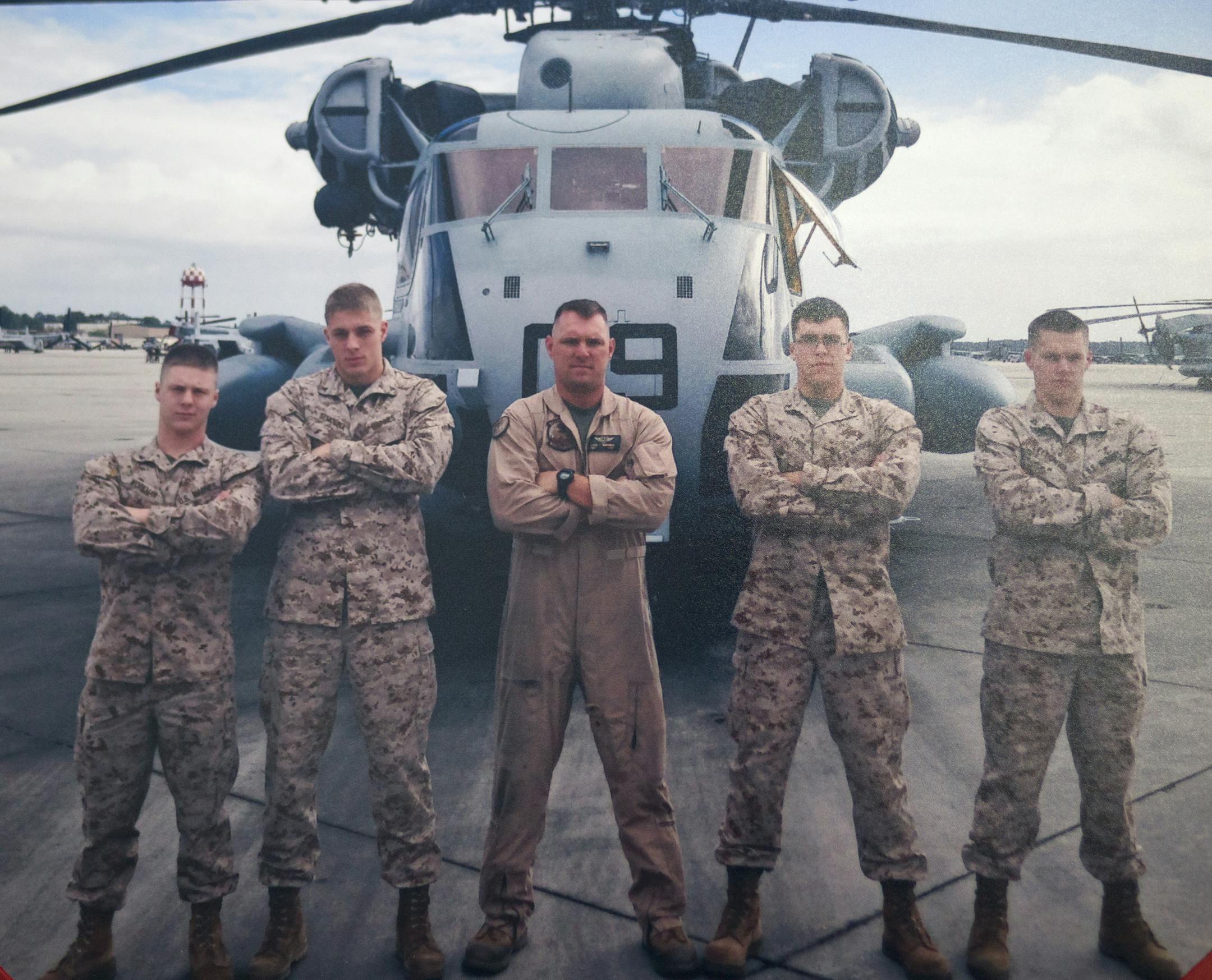 Sgt. Dillon Semolina, pictured second to left, in a photo provided by his mother and stepfather Mike and Lisa De La Cruz at their home in Bloomington on Wednesday, February 17, 2016. ] (Leila Navidi/Star Tribune) leila.navidi@startribune.com BACKGROUND INFORMATION: Sgt. Dillon Semolina, 24, of Chaska, Minn. died in a Hawaii helicopter crash on Jan. 14. Semolina was a crew chief with the Marine Heavy Helicopter Squadron.