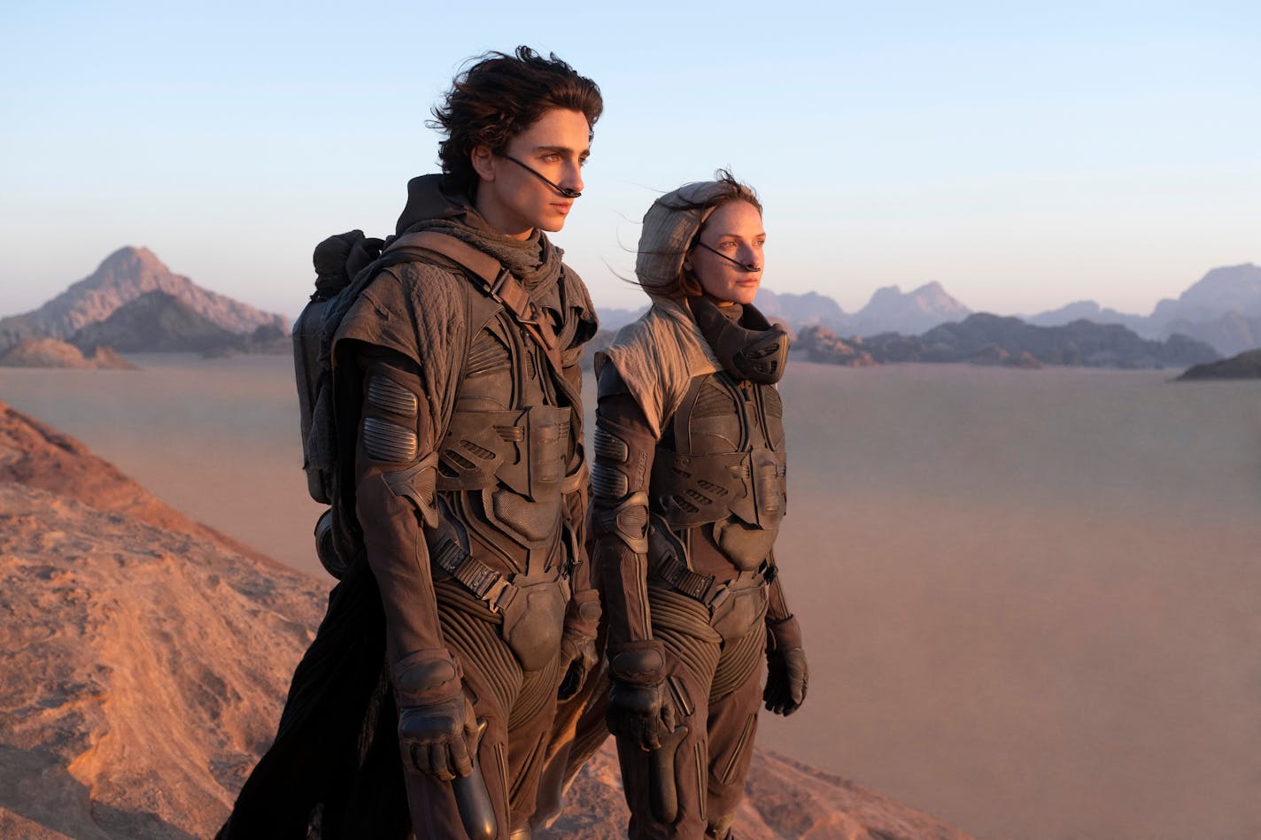 This image released by Warner Bros. Pictures shows Timothee Chalamet, left, and Rebecca Ferguson in a scene from "Dune." (Warner Bros. Pictures via AP)