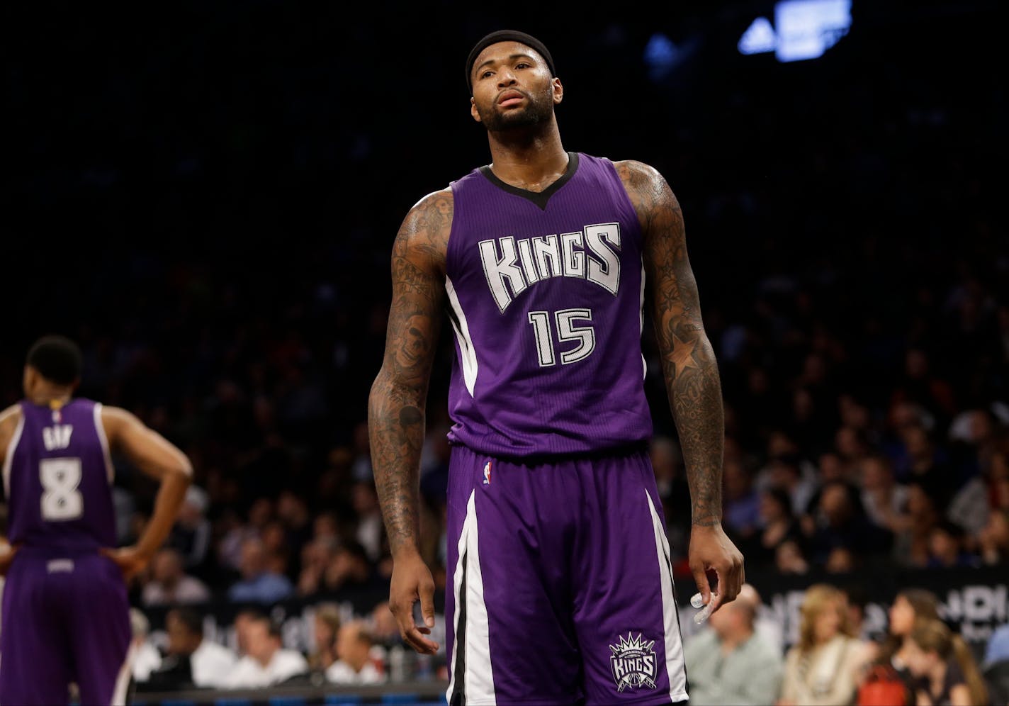 Sacramento Kings' DeMarcus Cousins (15) reacts during the second half of an NBA basketball game against the Brooklyn Nets, Monday, Dec. 29, 2014, in New York. The Nets won the game 107-99. (AP Photo/Frank Franklin II)