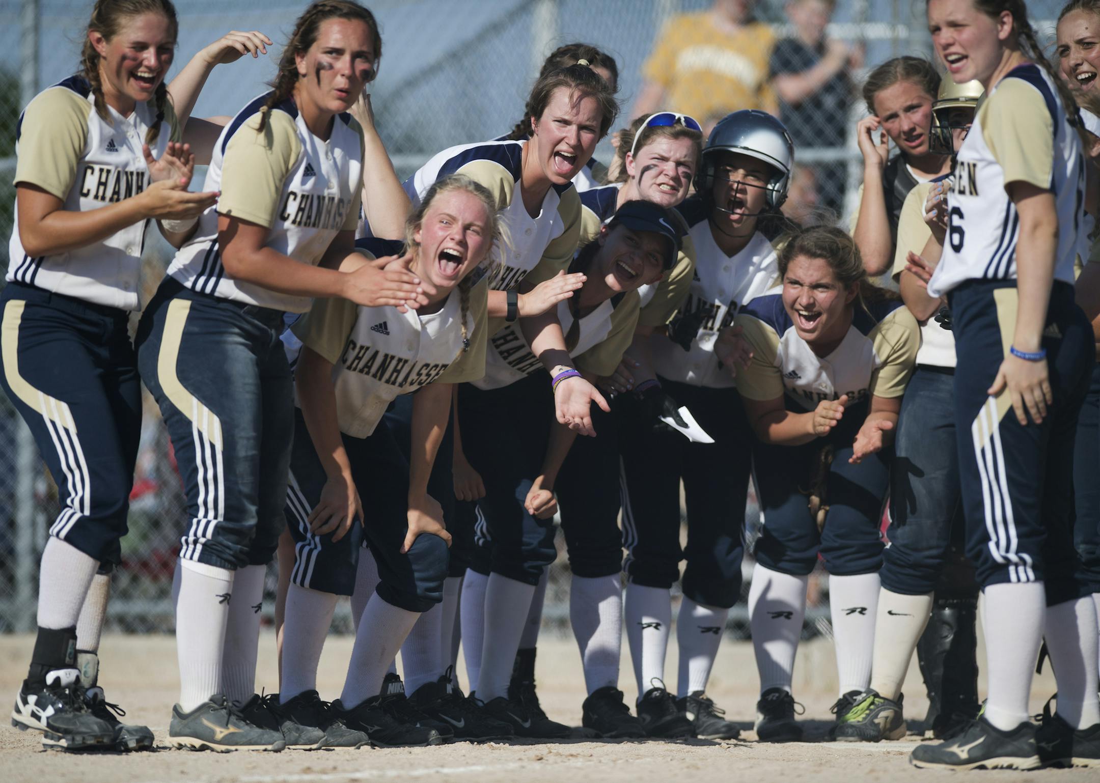 Chanhassen players cheer at the plate for Chanhassen catcher Jessica Bren (21) as she approaches after hitting a three-run homer in the sixth inning to extend Chanhassen's lead 10-1. Chanhassen defeated Hopkins 10-1 on Thursday. ] Isaac Hale ï isaac.hale@startribune.com Teams from across Minnesota met at Caswell Park in North Mankato on Thursday, June 9, 2016, to compete in the State Girls Softball Tournament Semifinals.