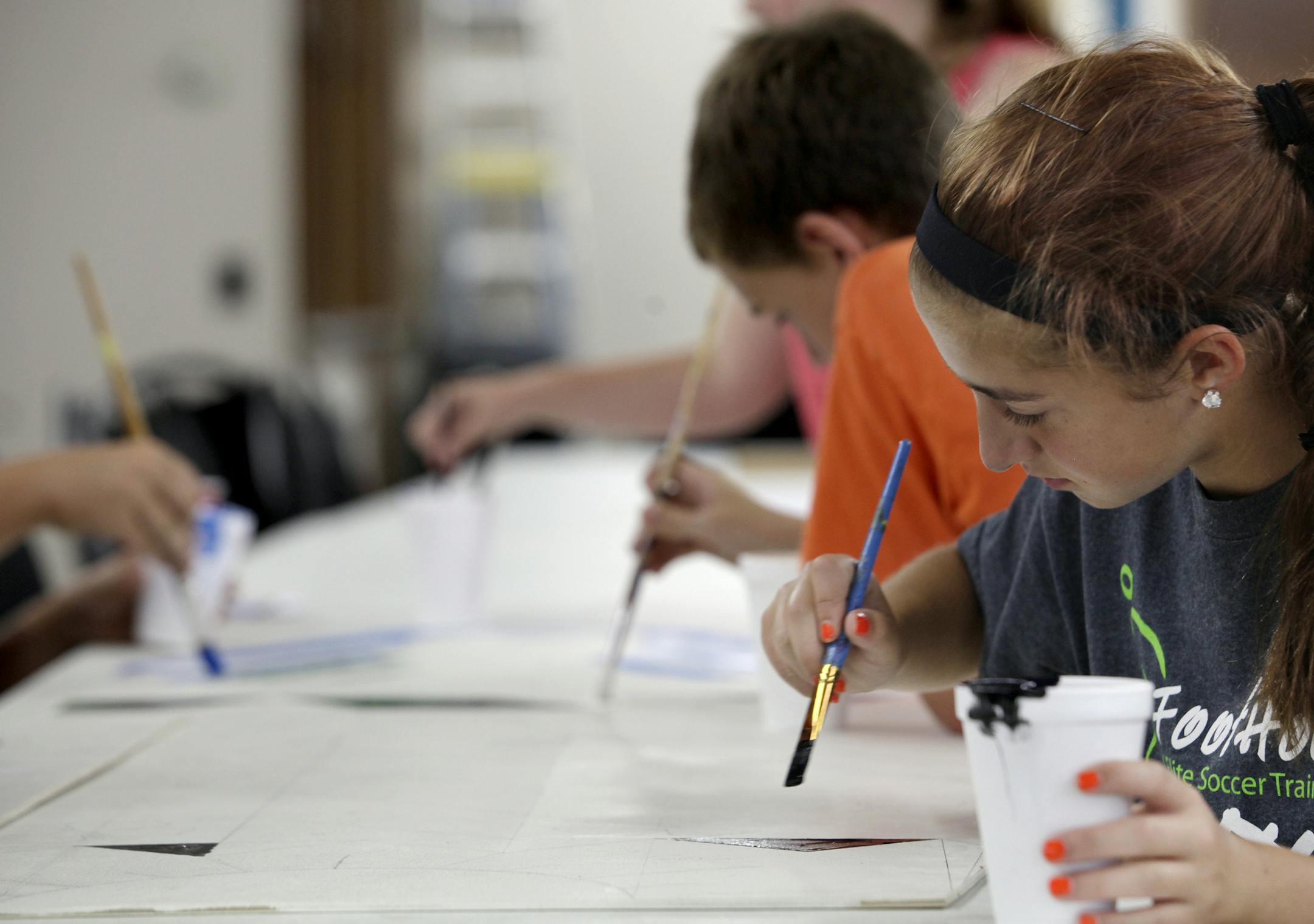 Lauren Pendar works on set for the "Arts-In", in preparation for Washington County Fair in Lake Elmo, MN. on July 16, 2013. ] JOELKOYAMA‚Ä¢joel koyama@startribune July 12, 2013. ] JOELKOYAMA‚Ä¢joel koyama@startribune An "Arts-In" camp will be preparing skits, painting art work, rehearsing music, etc., in preparation for Washington County Fair. Camp also is open Monday, although there might be more to see on Tuesday. This is the centerpiece photo for an advancer