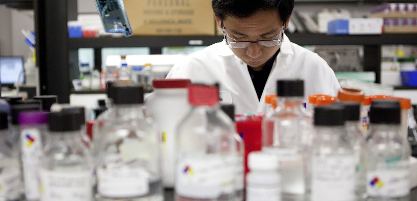 FILE -- A research associate in a lab at Cubist Pharmaceuticals, which makes drugs to treat dangerous superbugs and bacteria, in Lexington, Mass., Oct. 13, 2010. Merck & Company&#x201a;&#xc4;&#xf4;s deal to acquire Cubist for $8.4 billion, as well as the assumption of its debt, will give Merck control of the largest antibiotics company and deepen its ties with hospitals. (Matthew Cavanaugh/The New York Times) ORG XMIT: MIN2015010215065858